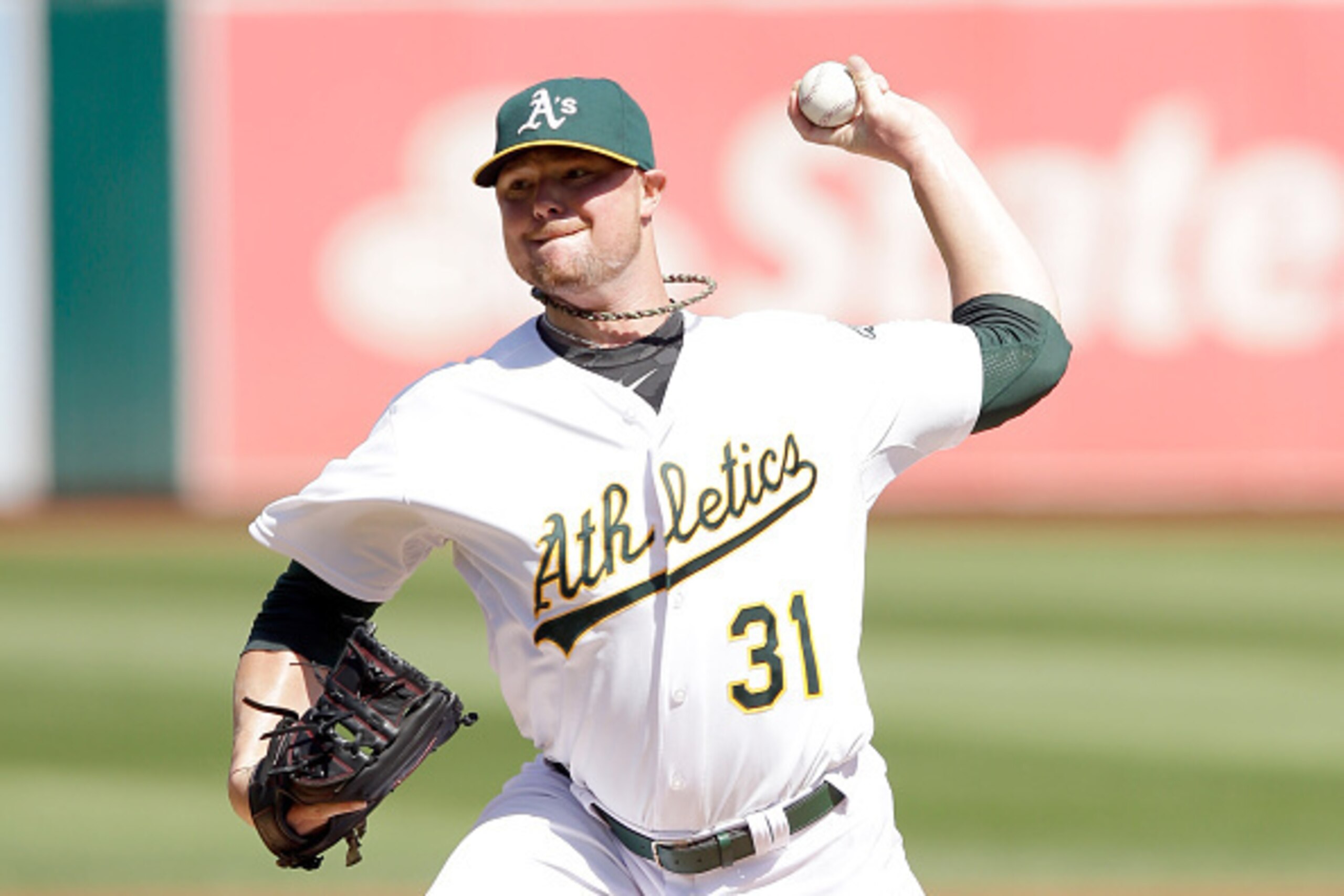 OAKLAND, CA - SEPTEMBER 24:  Jon Lester #31 of the Oakland Athletics pitches against the Los Angeles Angels of Anaheim at O.co Coliseum on September 24, 2014 in Oakland, California.  (Photo by Ezra Shaw/Getty Images)