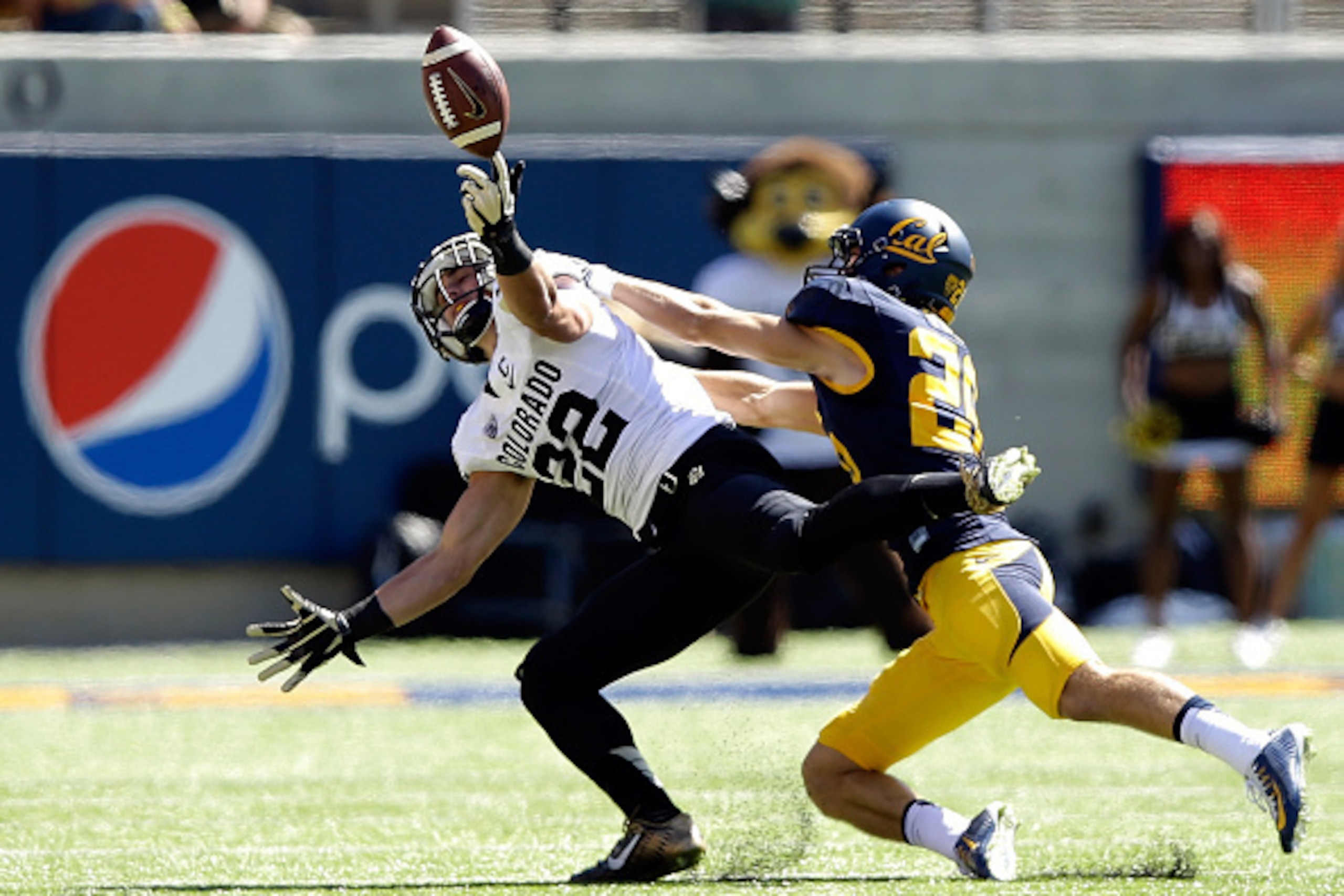BERKELEY, CA - SEPTEMBER 27:  Nelson Spruce #22 of the Colorado Buffaloes can not catch a pass while defended by Griffin Piatt #26 of the California Golden Bears at California Memorial Stadium on September 27, 2014 in Berkeley, California.  (Photo by Ezra