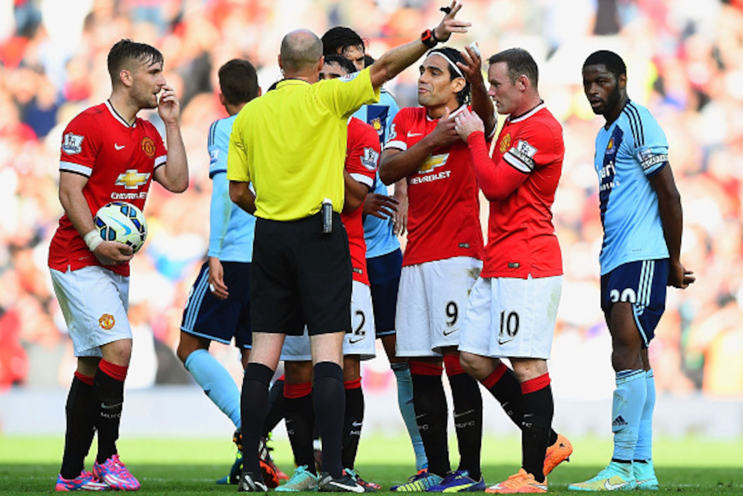 MANCHESTER, ENGLAND - SEPTEMBER 27:  Wayne Rooney of Manchester United receives a straight red card by referee Lee Mason after a foul on Stewart Downing of West Ham during the Barclays Premier League match between Manchester United and West Ham United at 