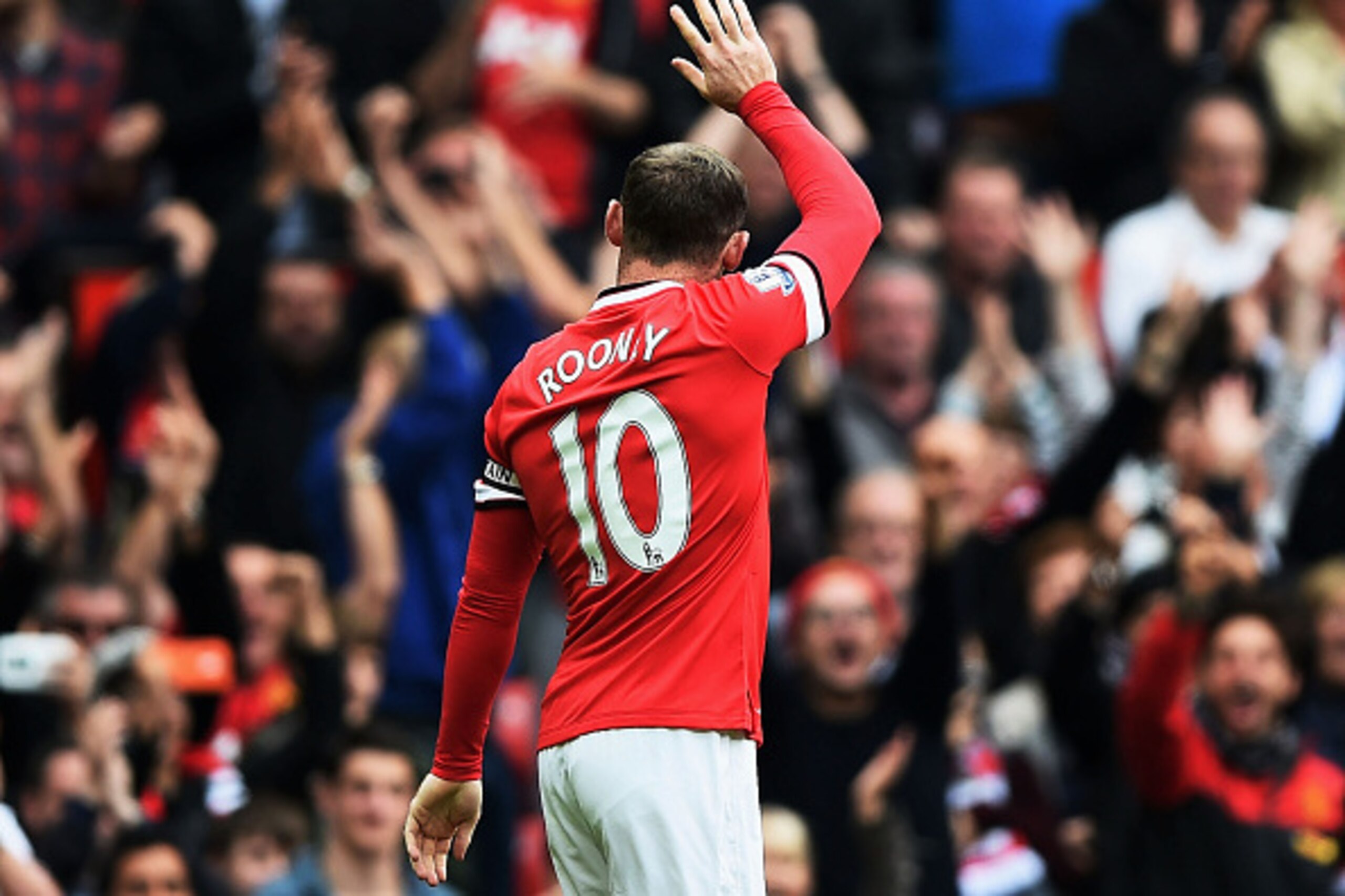 MANCHESTER, ENGLAND - SEPTEMBER 27: Wayne Rooney of Manchester United celebrates after scoring the opening goal during the Barclays Premier League match between Manchester United and West Ham United at Old Trafford on September 27, 2014 in Manchester, Eng