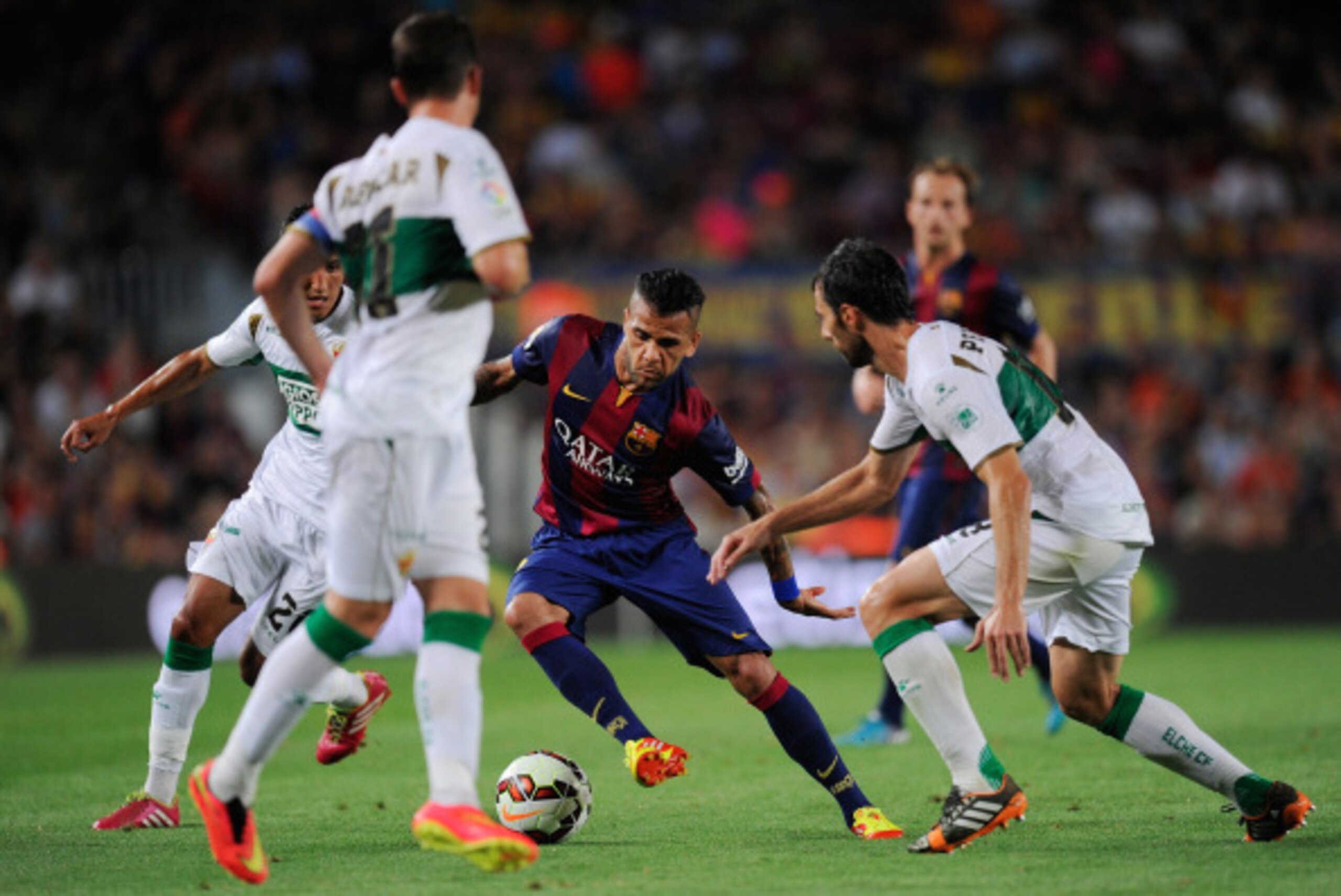 BARCELONA, SPAIN - AUGUST 24:  Dani Alves of FC Barcelona in action during the La Liga match between FC Barcelona and Elche FC at Camp Nou stadium on August 24, 2014 in Barcelona, Spain.  (Photo by Denis Doyle/Getty Images)