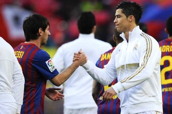 BARCELONA, SPAIN - APRIL 21:  Lionel Messi of FC Barcelona (L) and Cristiano Ronaldo of Real Madrid CF shake hands prior to the La Liga match between FC Barcelona and Real Madrid at Camp Nou on April 21, 2012 in Barcelona, Spain. Real Madrid CF won 1-2.  