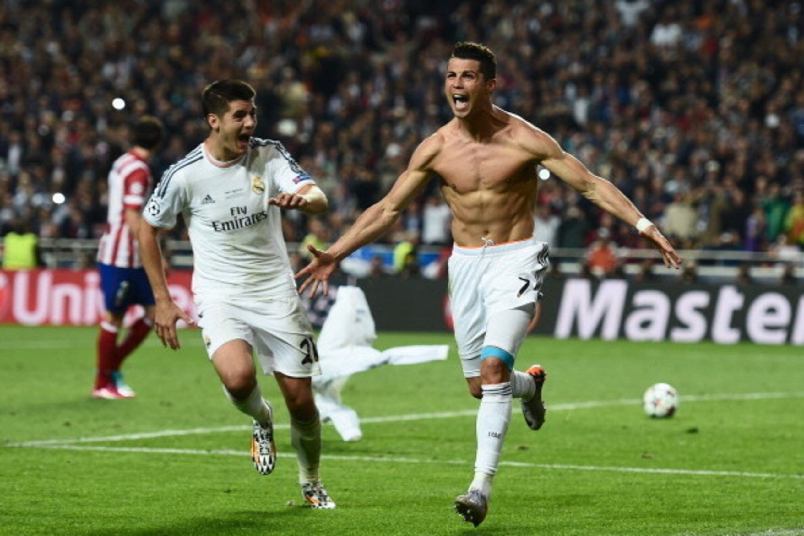 LISBON, PORTUGAL - MAY 24: Cristiano Ronaldo of Real Madrid celebrates after scoring their fourth goal from the penalty spot during the UEFA Champions League Final between Real Madrid and Atletico de Madrid at Estadio da Luz on May 24, 2014 in Lisbon, Po LISBON, PORTUGAL - MAY 24: Cristiano Ronaldo of Real Madrid celebrates after scoring their fourth goal from the penalty spot during the UEFA Champions League Final between Real Madrid and Atletico de Madrid at Estadio da Luz on May 24, 2014 in Lisbon, Po