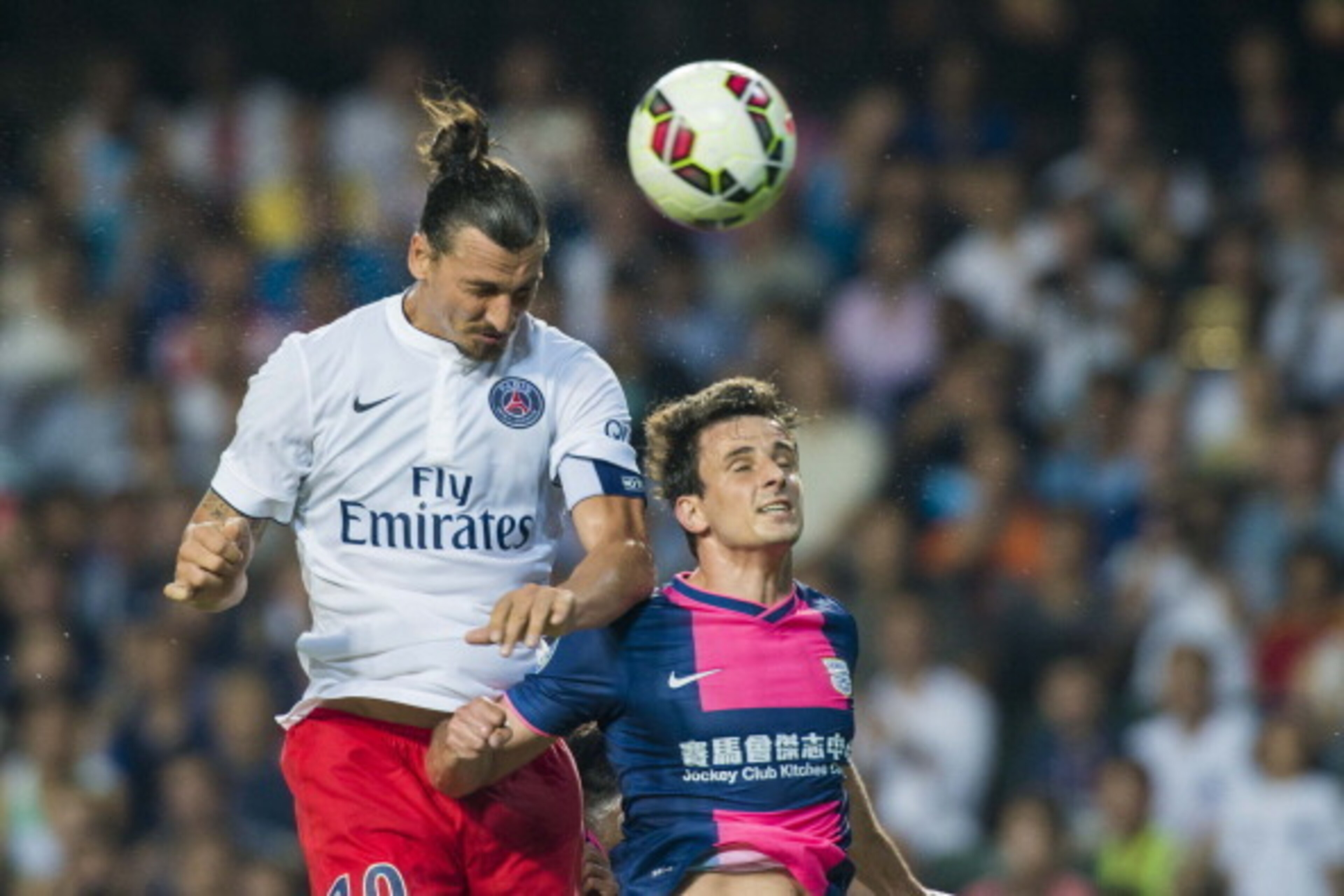 HONG KONG - JULY 29:  Zlatan Ibrahimovic (L) of Paris Saint-Germain scores during the friendly match between Kitchee and Paris Saint-Germain at Hong Kong Stadium on July 29, 2014 in Hong Kong, Hong Kong.  (Photo by Victor Fraile/Getty Images)