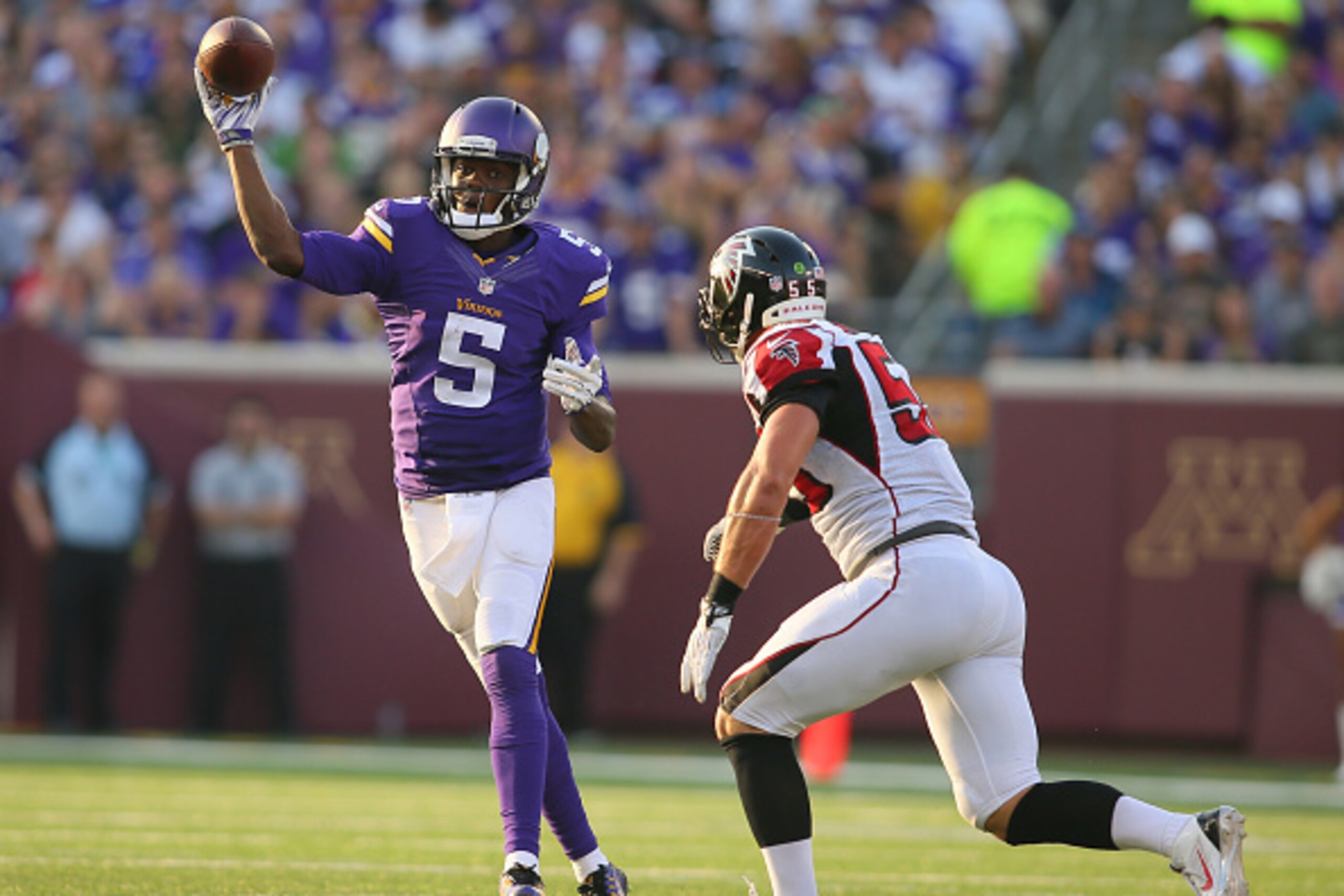 MINNEAPOLIS, MN - SEPTEMBER 28: Teddy Bridgewater #5 of the Minnesota Vikings passes under pressure from Paul Worrilow #55 of the Atlanta Falcons at TCF Bank Stadium on September 28, 2014 in Minneapolis, Minnesota. (Photo by Adam Bettcher/Getty Images)
