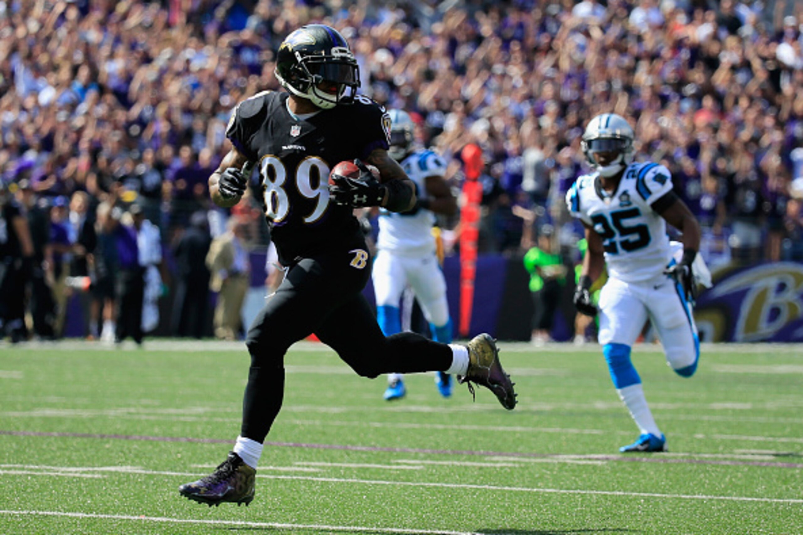 BALTIMORE, MD - SEPTEMBER 28:  Wide receiver Steve Smith #89 of the Baltimore Ravens scores a touchdown in the second quarter of a game against the Carolina Panthers at M&T Bank Stadium on September 28, 2014 in Baltimore, Maryland.  (Photo by Rob Carr/Get