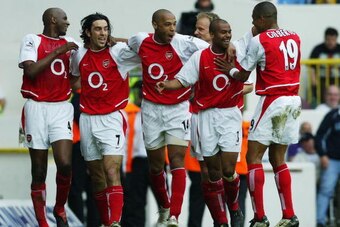 LONDON - APRIL 25: Patrick Vieira, Robert Pires, Thierry Henry, Ashley Cole and Gilberto Silva of Arsenal celebrate after the second goal during the FA Barclaycard Premiership match between Tottenham Hotspur and Arsenal at White Hart Lane on April 25, 200