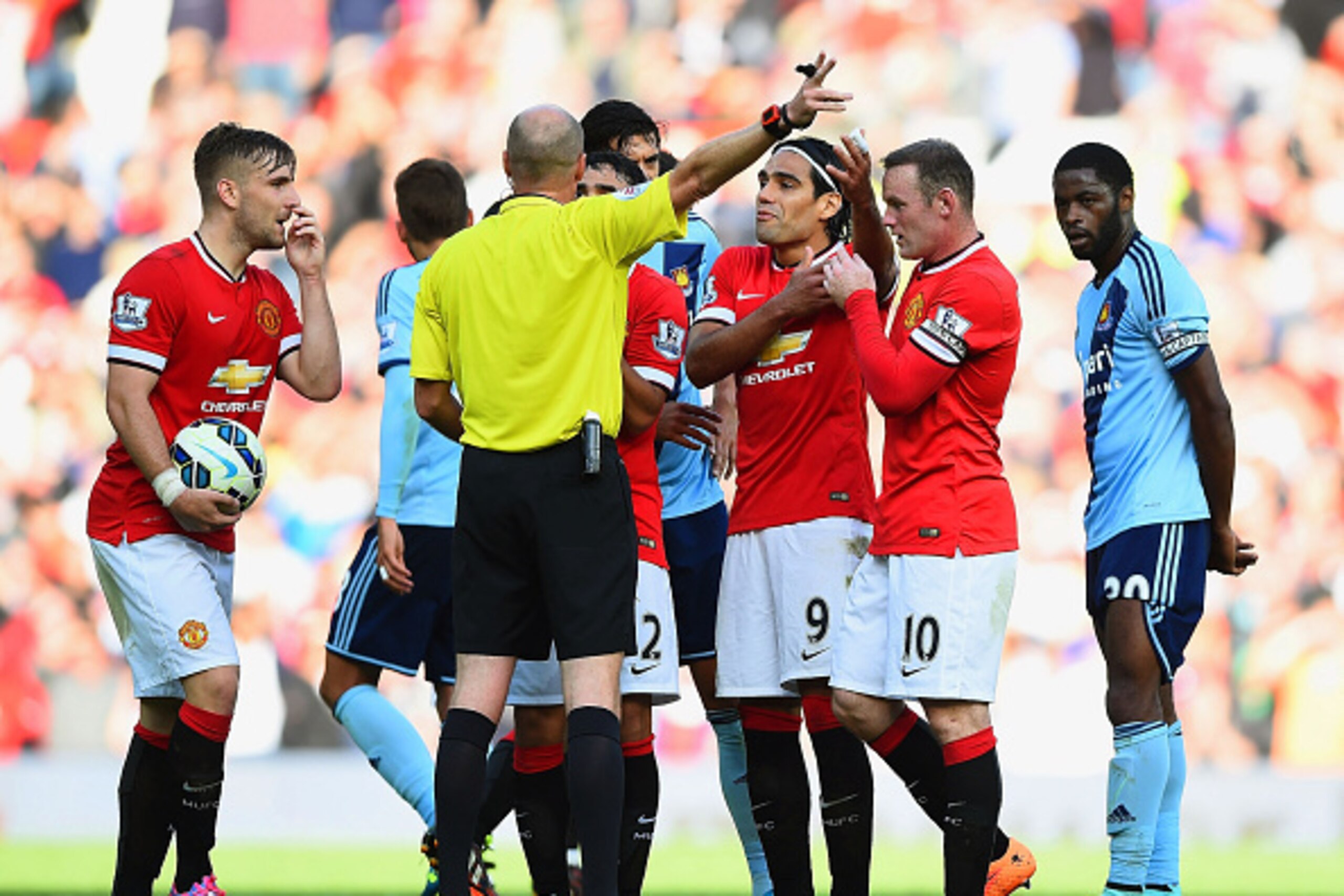 MANCHESTER, ENGLAND - SEPTEMBER 27:  Wayne Rooney of Manchester United receives a straight red card by referee Lee Mason after a foul on Stewart Downing of West Ham during the Barclays Premier League match between Manchester United and West Ham United at 