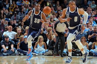 DENVER, CO - MARCH 01:  Kevin Durant #35 of the Oklahoma City Thunder and Russell Westbrook #0 of the Oklahoma City Thunder head up court against the Denver Nuggets at the Pepsi Center on March 1, 2013 in Denver, Colorado. NOTE TO USER: User expressly ack