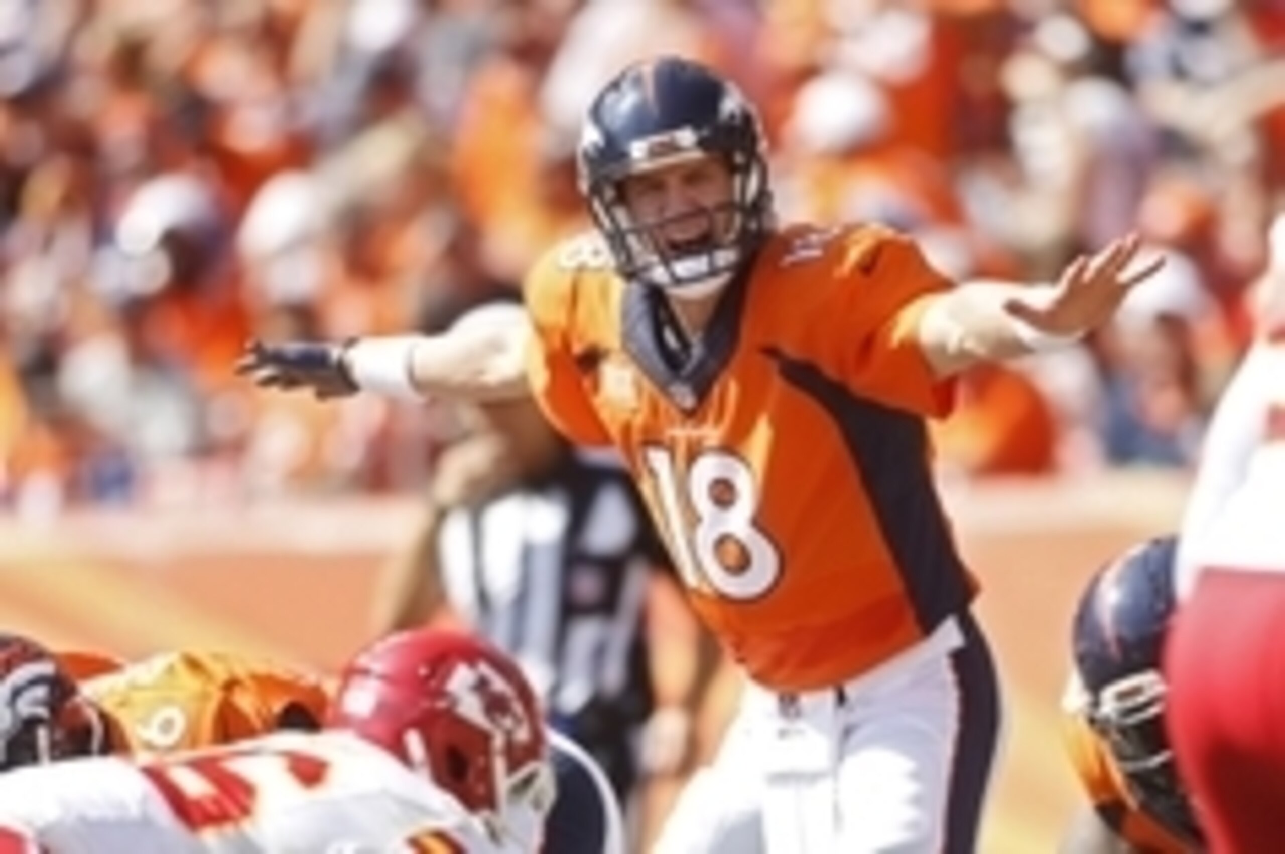 Sep 14, 2014; Denver, CO, USA; Denver Broncos quarterback Peyton Manning (18) reacts at the line of scrimmage during the second half against the Kansas City Chiefs at Sports Authority Field at Mile High. Mandatory Credit: Chris Humphreys-USA TODAY Sports