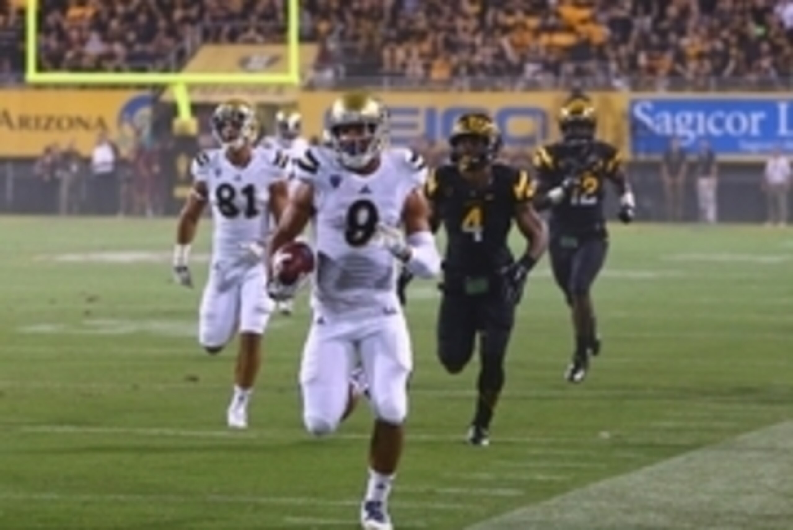 Sep 25, 2014; Tempe, AZ, USA; UCLA Bruins wide receiver Jordan Payton (9) runs the ball in the second half against the Arizona State Sun Devils at Sun Devil Stadium. UCLA defeated Arizona State 62-27. Mandatory Credit: Mark J. Rebilas-USA TODAY Sports