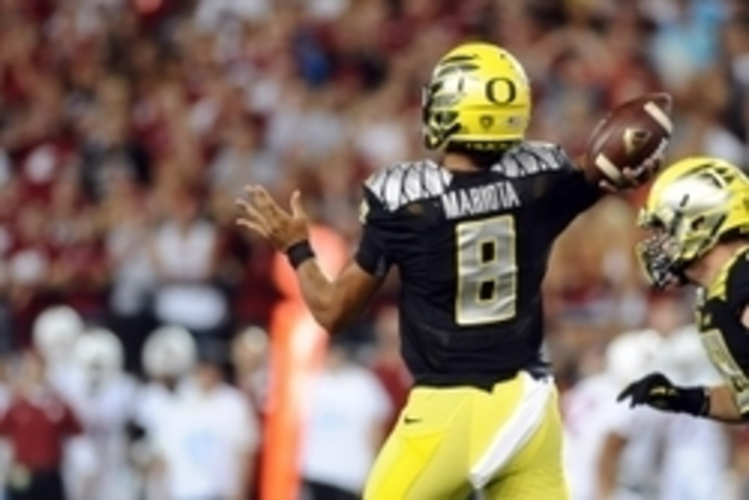 Sep 20, 2014; Pullman, WA, USA; Oregon Ducks quarterback Marcus Mariota (8) drops back for a pass against the Washington State Cougars during the first half at Martin Stadium. Mandatory Credit: James Snook-USA TODAY Sports