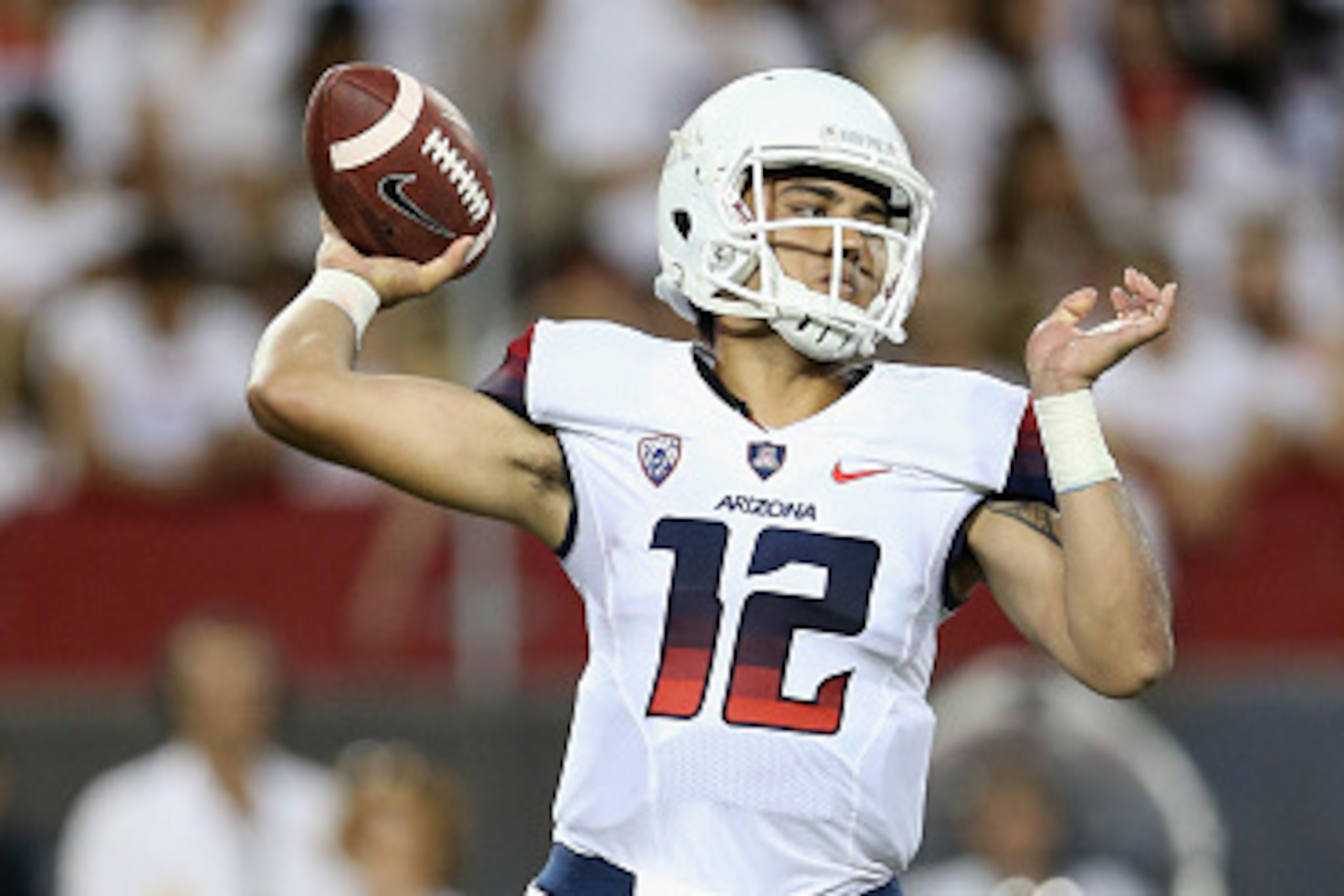TUCSON, AZ - SEPTEMBER 20:  Quarterback Anu Solomon #12 of the Arizona Wildcats drops back to pass during the college football game against the California Golden Bears at Arizona Stadium on September 20, 2014 in Tucson, Arizona. The Wildcats defeated the 