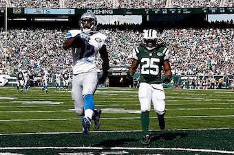 EAST RUTHERFORD, NJ - SEPTEMBER 28:  Jeremy Ross #12 of the Detroit Lions scores a 59-yard touchdown in the in the second quarter as  Calvin Pryor #25 of the New York Jets looks on at MetLife Stadium on September 28, 2014 in East Rutherford, New Jersey.  