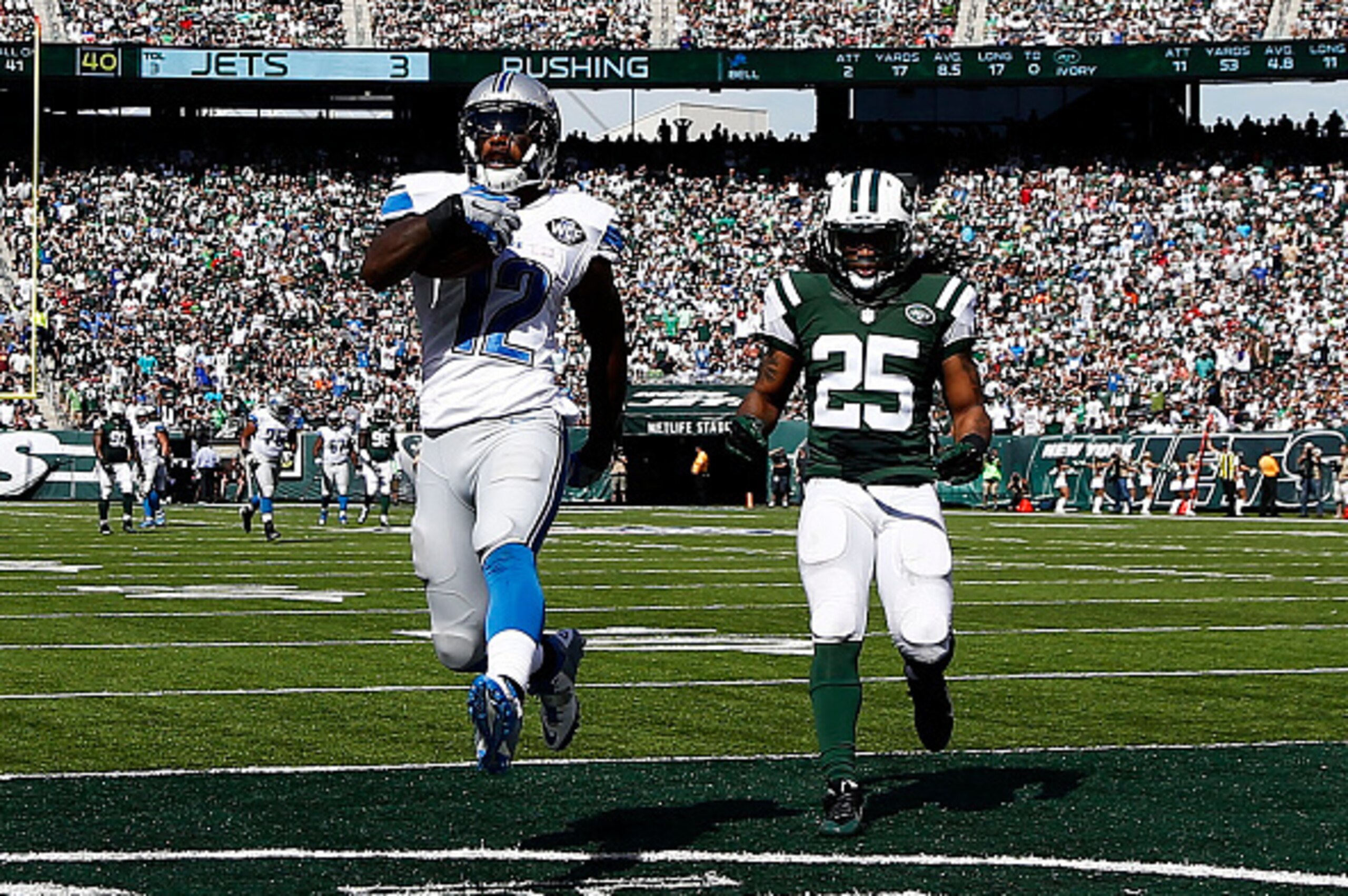 EAST RUTHERFORD, NJ - SEPTEMBER 28: Jeremy Ross #12 of the Detroit Lions scores a 59-yard touchdown in the in the second quarter as Calvin Pryor #25 of the New York Jets looks on at MetLife Stadium on September 28, 2014 in East Rutherford, New Jersey. EAST RUTHERFORD, NJ - SEPTEMBER 28: Jeremy Ross #12 of the Detroit Lions scores a 59-yard touchdown in the in the second quarter as Calvin Pryor #25 of the New York Jets looks on at MetLife Stadium on September 28, 2014 in East Rutherford, New Jersey.