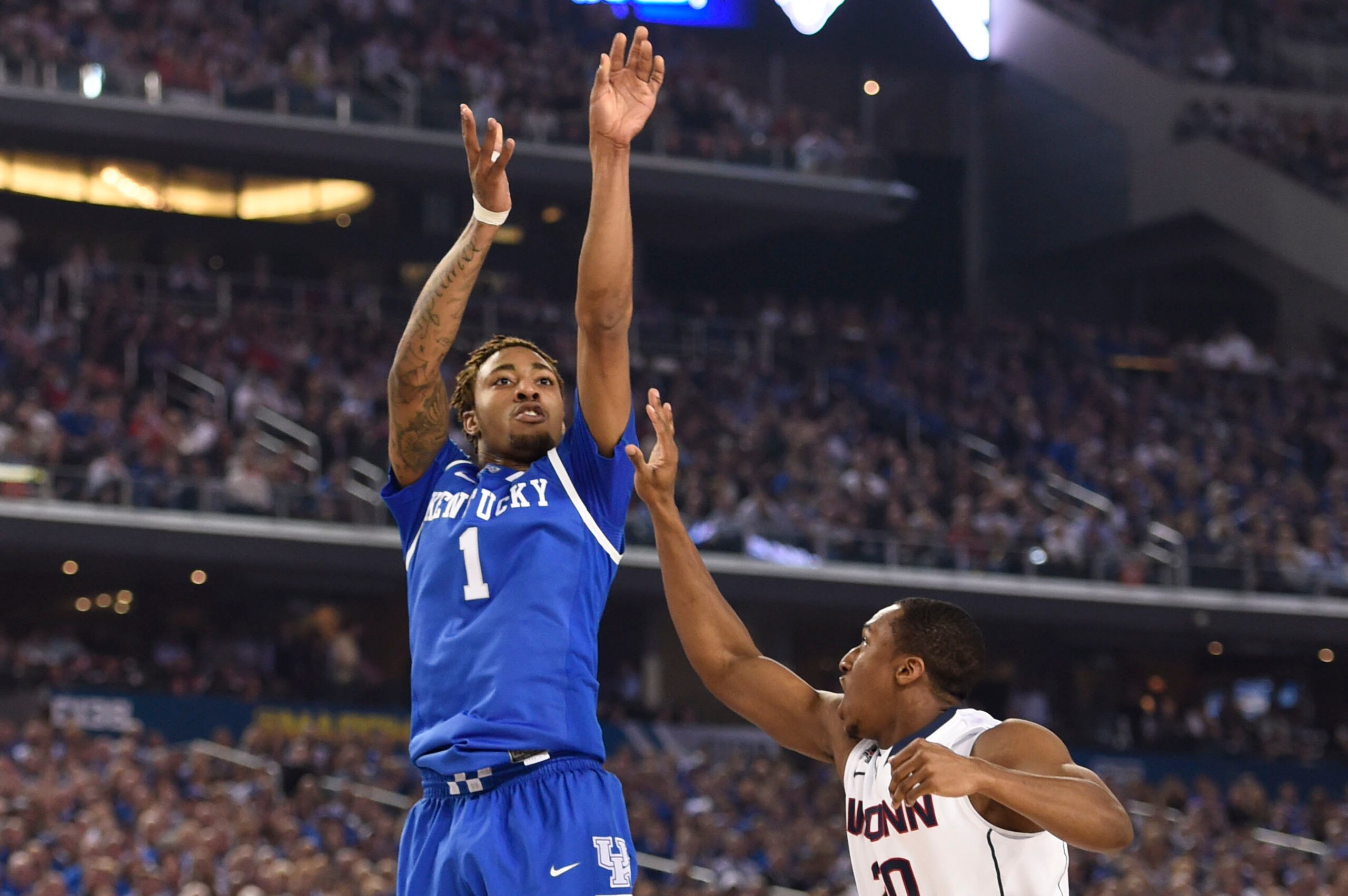 Apr 7, 2014; Arlington, TX, USA; Kentucky Wildcats guard/forward James Young (1) shoots over Connecticut Huskies guard/forward Lasan Kromah (20) in the first half during the championship game of the Final Four in the 2014 NCAA Mens Division I Championship