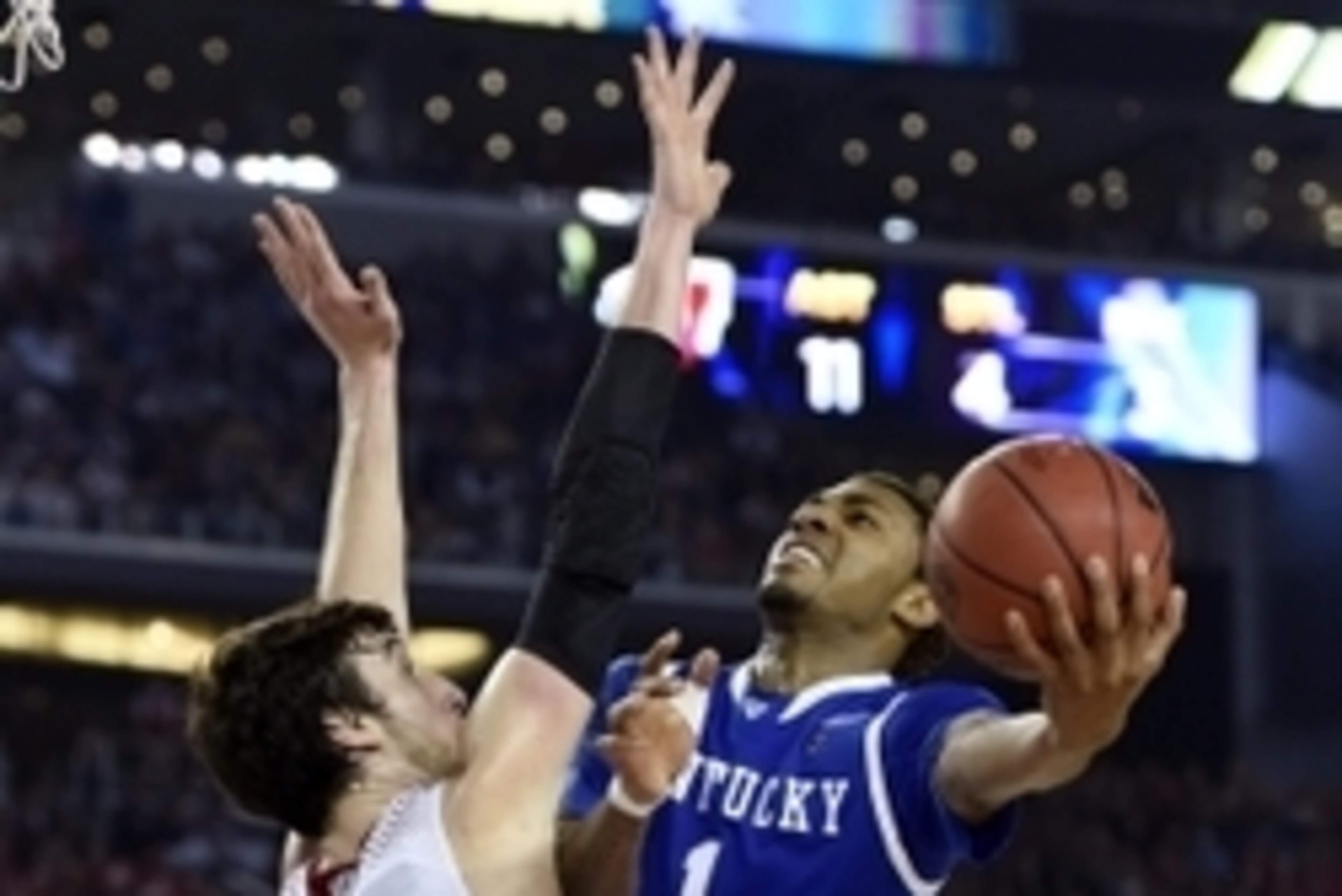 Apr 5, 2014; Arlington, TX, USA; Kentucky Wildcats guard/forward James Young (1) shoots against Wisconsin Badgers forward Frank Kaminsky (44) during the semifinals of the Final Four in the 2014 NCAA Mens Division I Championship tournament at AT&T Stadium. Apr 5, 2014; Arlington, TX, USA; Kentucky Wildcats guard/forward James Young (1) shoots against Wisconsin Badgers forward Frank Kaminsky (44) during the semifinals of the Final Four in the 2014 NCAA Mens Division I Championship tournament at AT&T Stadium.