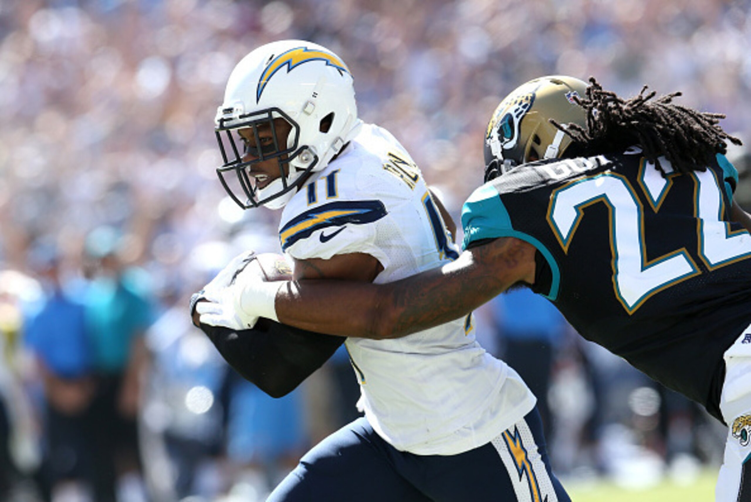SAN DIEGO, CA - SEPTEMBER 28:  Wide receiver Eddie Royal #11 of the San Diego Chargers carries the ball on a 43 yard touchdown pass play in the second quarter past safety Winston Guy Jr. #22 of the Jacksonville Jaguars at Qualcomm Stadium on September 28,