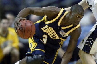 MINNEAPOLIS - MARCH 27:  Dwyane Wade #3 of the Marquette University Golden Eagles drives around Donatas Zavackas #5 of the University of Pittsburgh Panthers during the Midwest Regional of the NCAA Men's Basketball Championship at the Hubert H. Humphrey Me