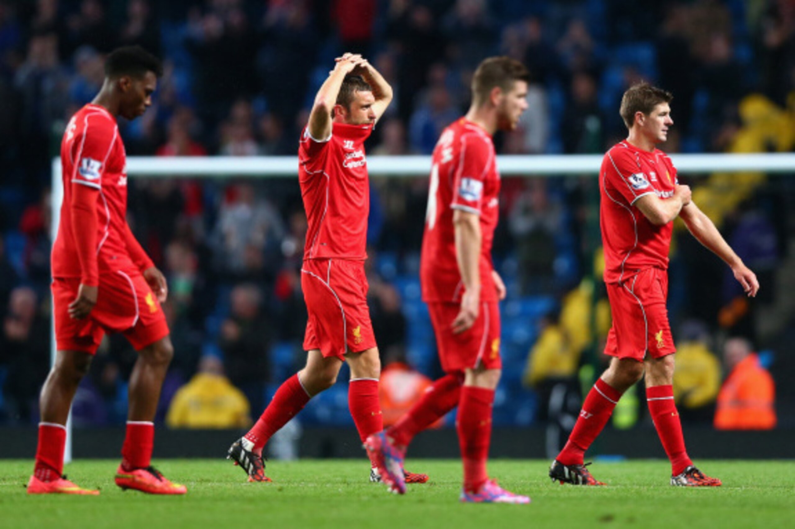 MANCHESTER, ENGLAND - AUGUST 25:  Steven Gerrard of Liverpool and his team-mates walk off dejectedly at the end of the Barclays Premier League match between Manchester City and Liverpool at the Etihad Stadium on August 25, 2014 in Manchester, England.  (P