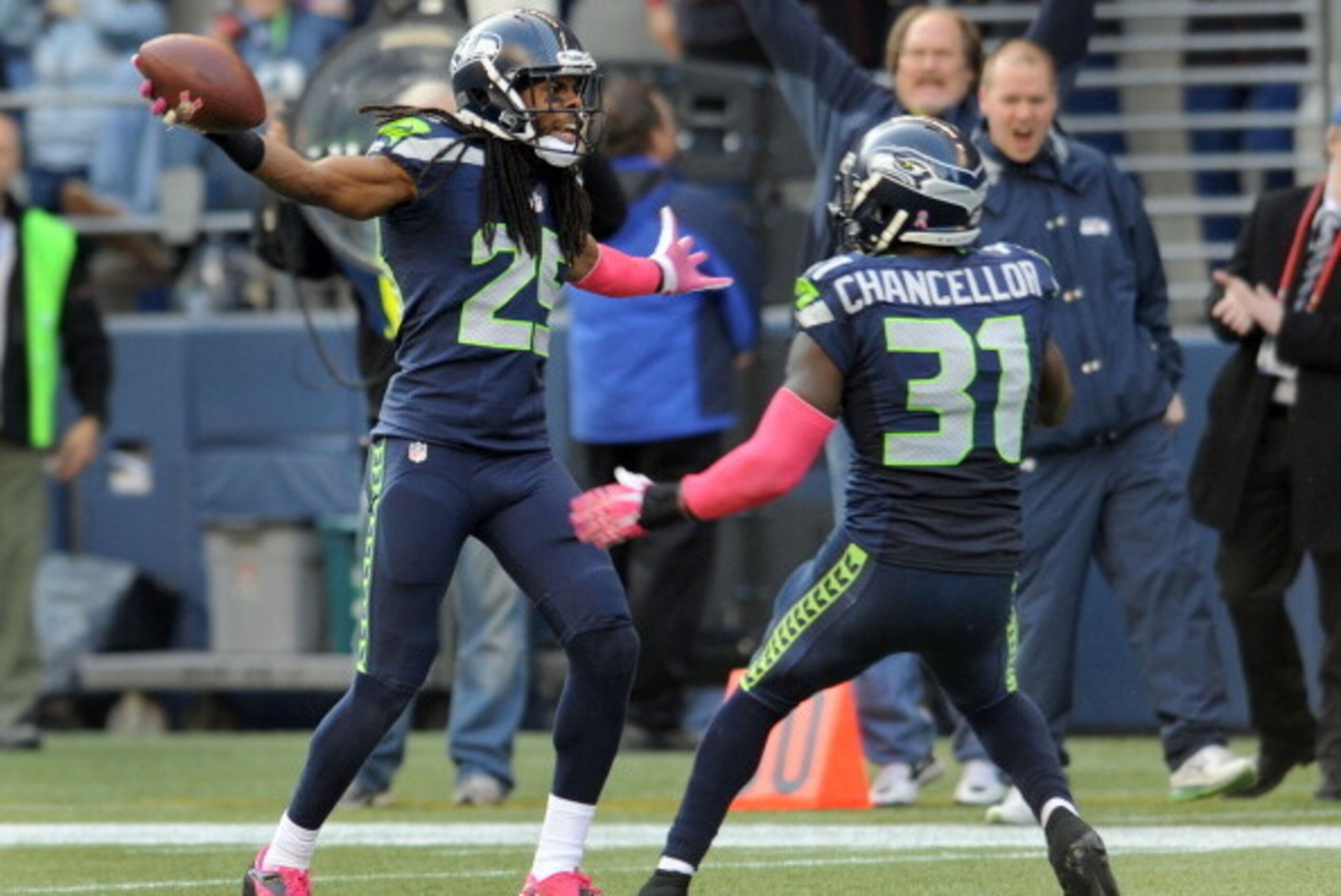 SEATTLE, WA. - OCTOBER 13: Cornerback Richard Sherman #25 of the Seattle Seahawks celebrates an interception with teammate strong safety Kam Chancellor #31 of the Seattle Seahawks during the fourth quarter of the game against the Tennessee Titans at Centu