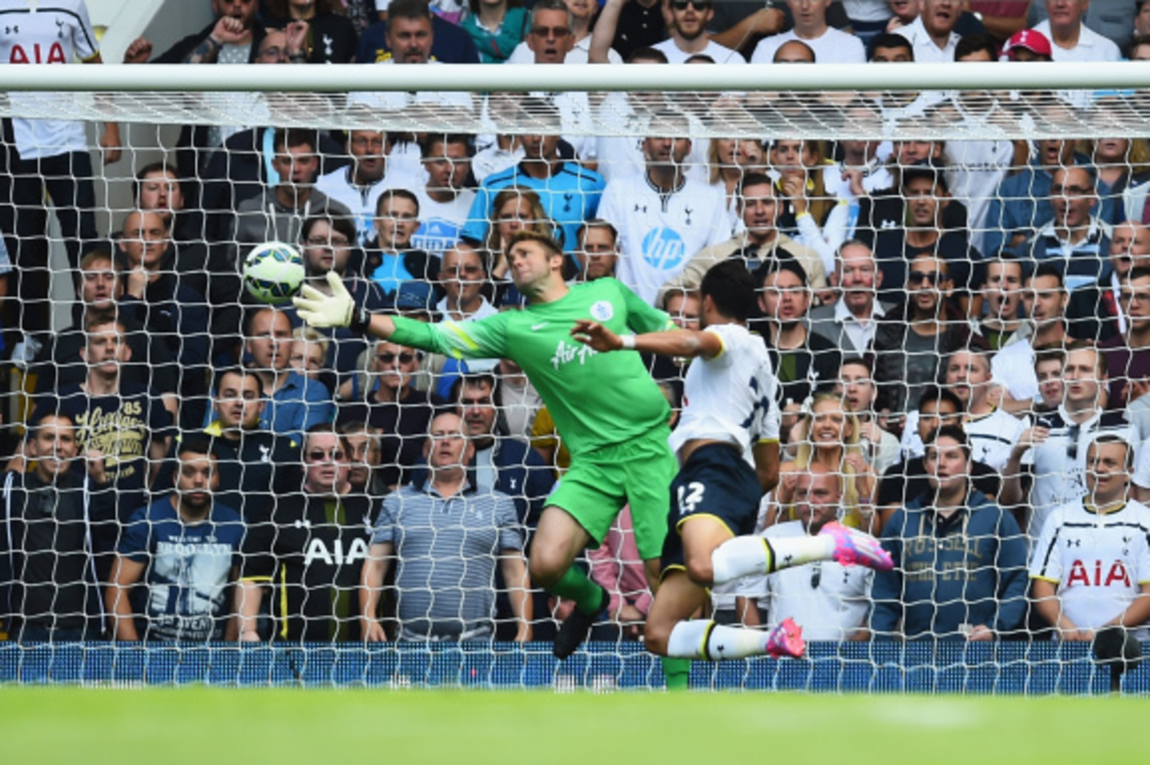 LONDON, ENGLAND - AUGUST 24: Nacer Chadli of Spurs heads past Robert Green of QPR to score his team's third goal during the Barclays Premier League match between Tottenham Hotspur and Queens Park Rangers at White Hart Lane on August 24, 2014 in London, E LONDON, ENGLAND - AUGUST 24: Nacer Chadli of Spurs heads past Robert Green of QPR to score his team's third goal during the Barclays Premier League match between Tottenham Hotspur and Queens Park Rangers at White Hart Lane on August 24, 2014 in London, E