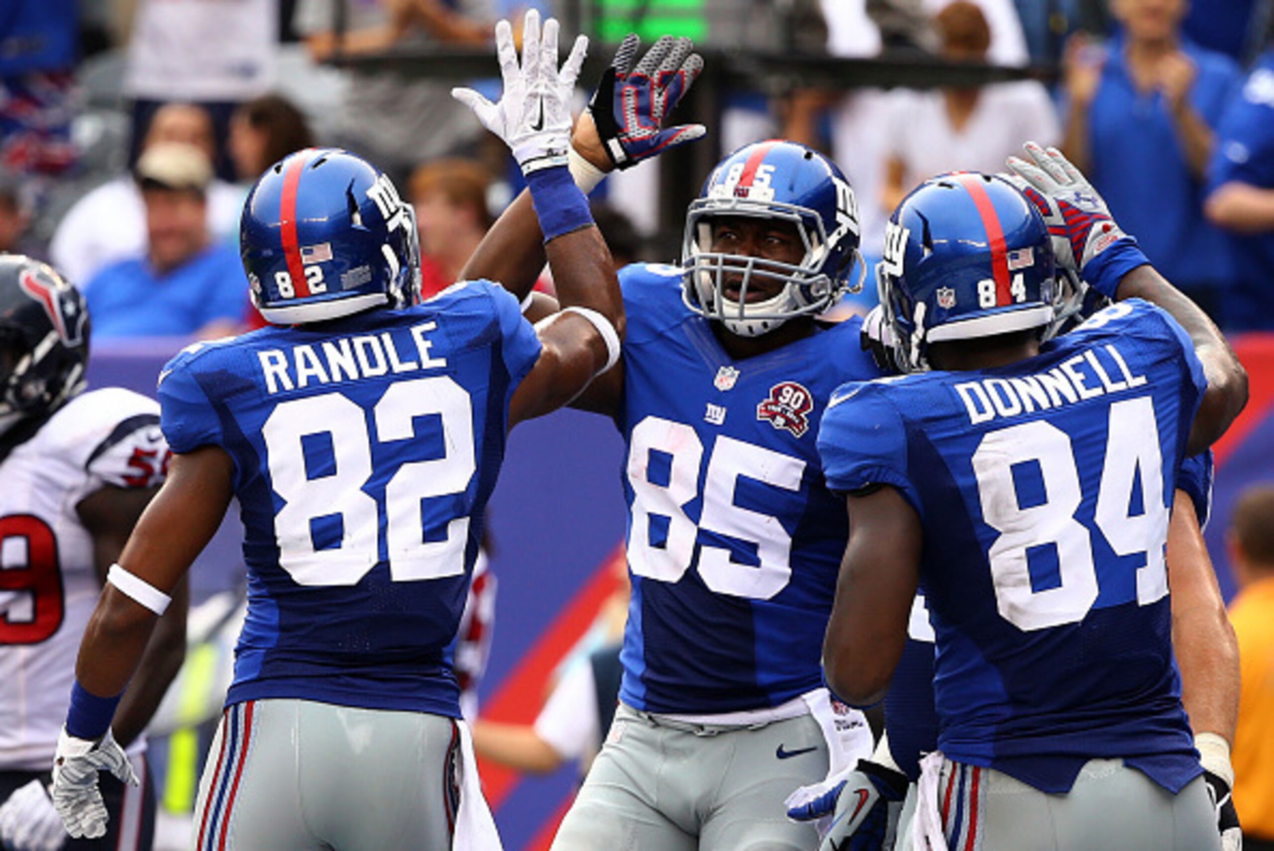 EAST RUTHERFORD, NJ - SEPTEMBER 21:  Daniel Fells #85 of the New York Giants celebrates with teammates  Rueben Randle #82 and  Larry Donnell #84 after scoring a touchdown against the Houston Texans in the third quarter at MetLife Stadium on September 21, 