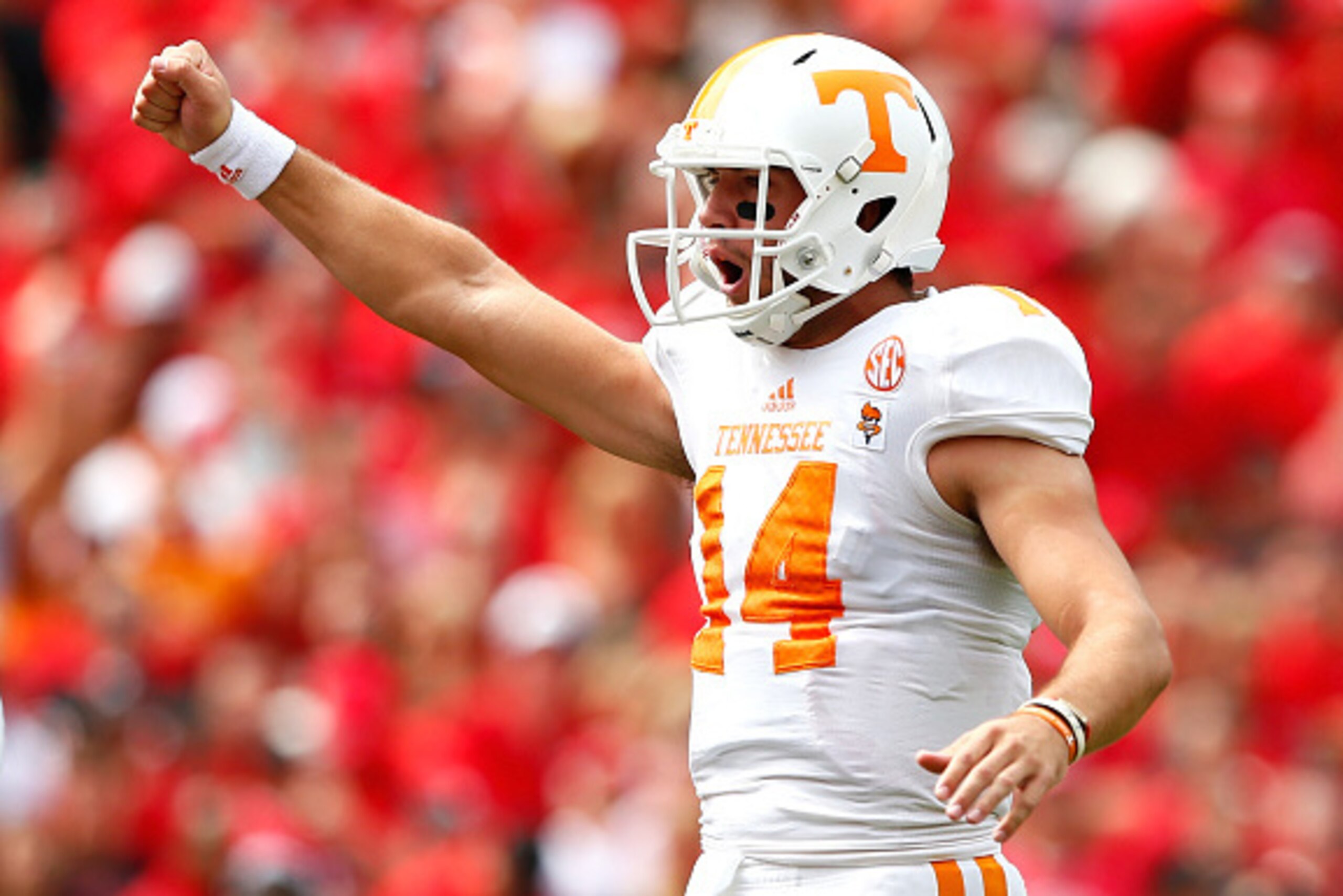 ATHENS, GA - SEPTEMBER 27:  Justin Worley #14 of the Tennessee Volunteers celebrates a touchdown by Jalen Hurd #1 of the Tennessee Volunteers against the Georgia Bulldogs at Sanford Stadium on September 27, 2014 in Athens, Georgia.  (Photo by Kevin C. Cox
