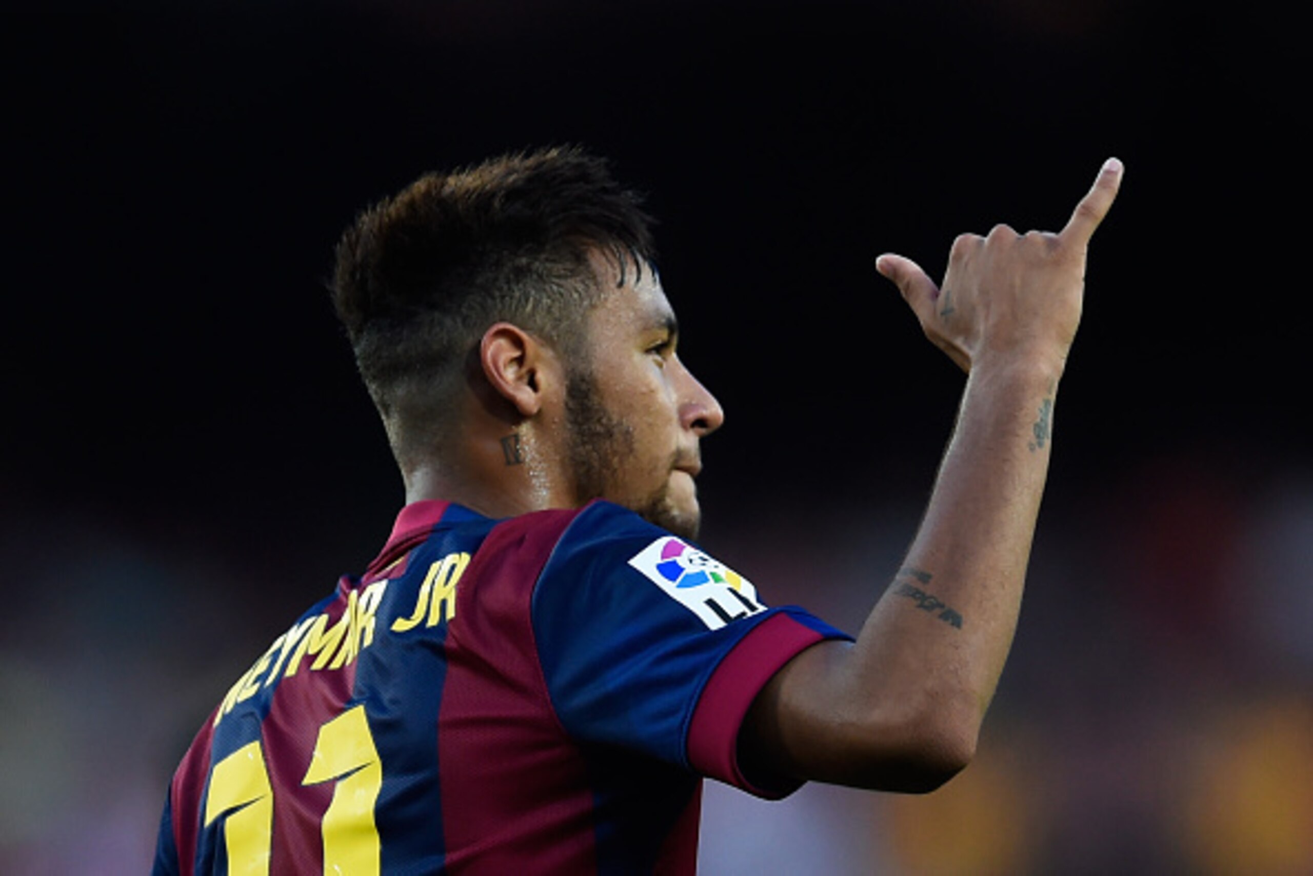 BARCELONA, SPAIN - SEPTEMBER 27:  Neymar of FC Barcelona celebrates after scoring his team's fifth goal during the La Liga match between FC Barcelona and Granada CF at Camp Nou on September 27, 2014 in Barcelona, Spain.  (Photo by David Ramos/Getty Images