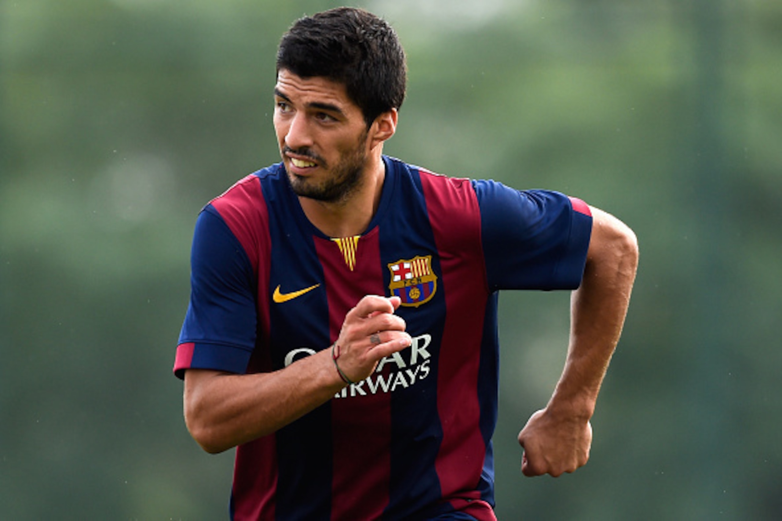 BARCELONA, SPAIN - SEPTEMBER 24:  Luis Suarez of FC Barcelona looks on during a friendly match between FC Barcelona B and Indonesia U19 at Ciutat Esportiva on September 24, 2014 in Barcelona, Spain.  (Photo by David Ramos/Getty Images)