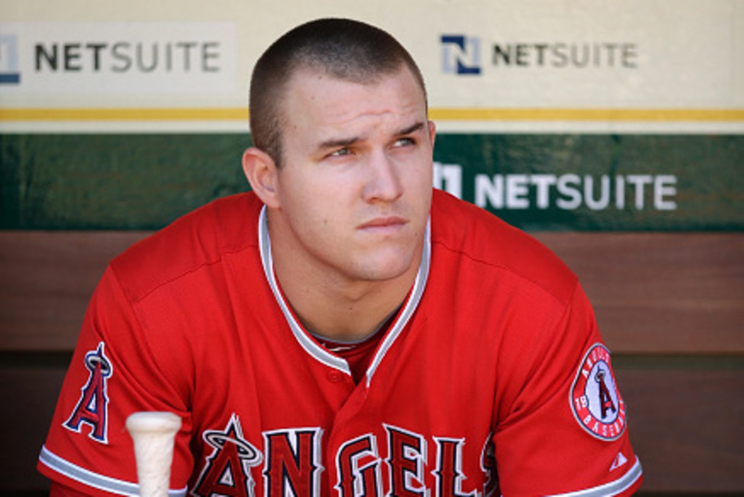OAKLAND, CA - SEPTEMBER 24:  Mike Trout #27 of the Los Angeles Angels of Anaheim sits in the dugout before their game against the Oakland Athletics at O.co Coliseum on September 24, 2014 in Oakland, California.  (Photo by Ezra Shaw/Getty Images)