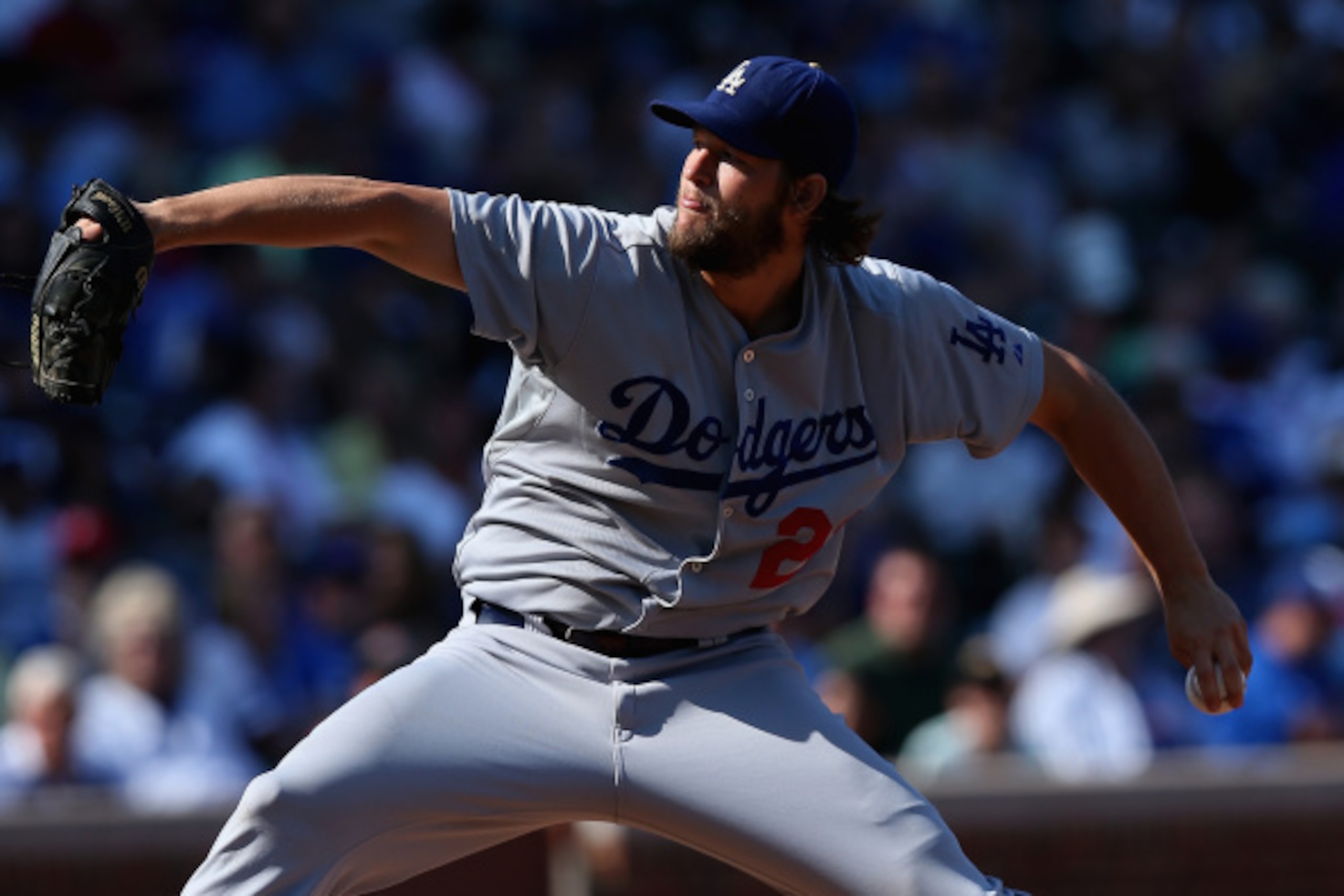 CHICAGO, IL - SEPTEMBER 19:  Starting pitcher Clayton Kershaw #22 of the Los Angeles Dodgers delivers the ball against the Chicago Cubs at Wrigley Field on September 19, 2014 in Chicago, Illinois. The Dodgers defeated the Cubs 14-5.  (Photo by Jonathan Da