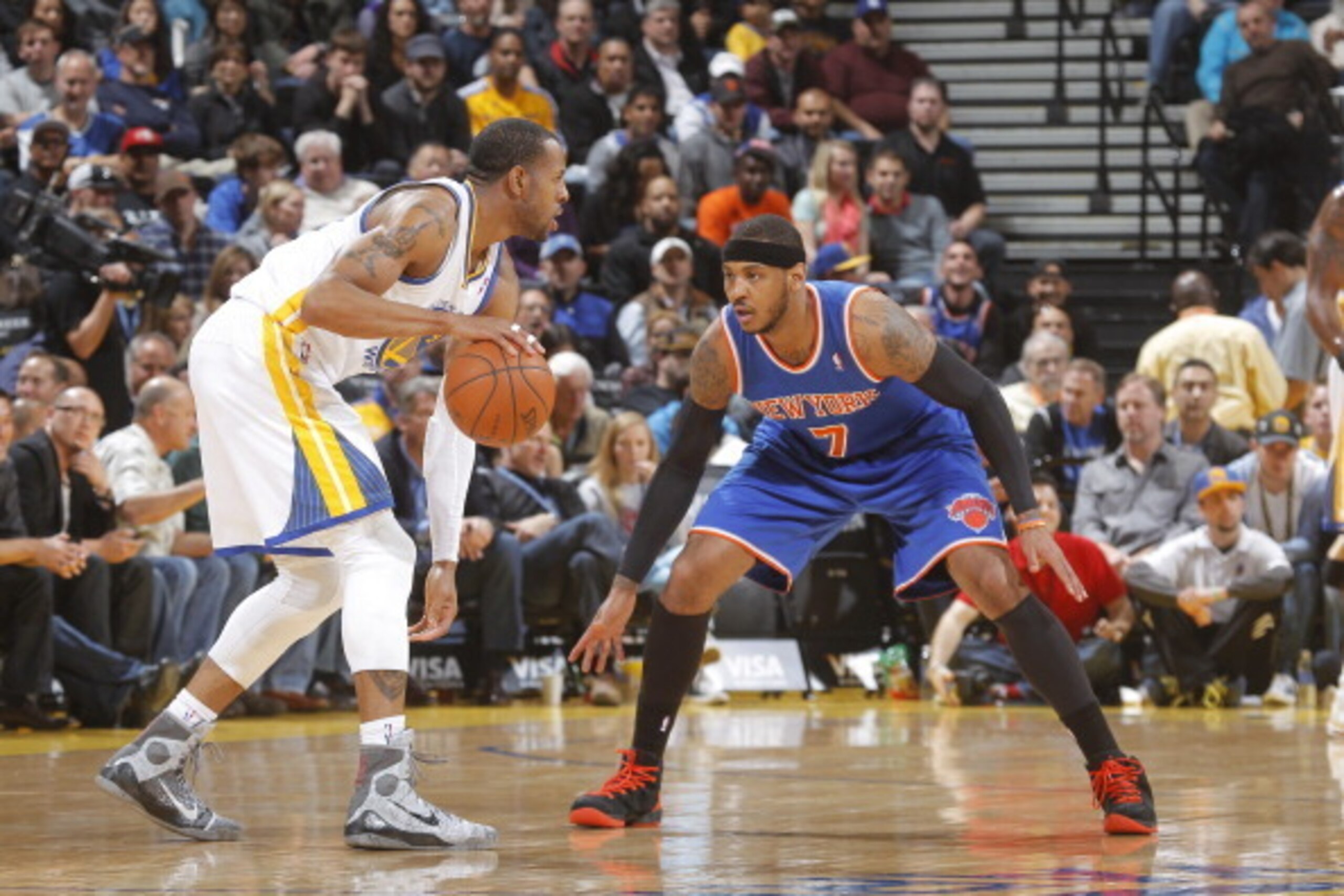 OAKLAND, CA - MARCH 30: Carmelo Anthony #7 of the New York Knicks defends Andre Iguodala #9 of the Golden State Warriors on March 30, 2014 at Oracle Arena in Oakland, California. NOTE TO USER: User expressly acknowledges and agrees that, by downloading an
