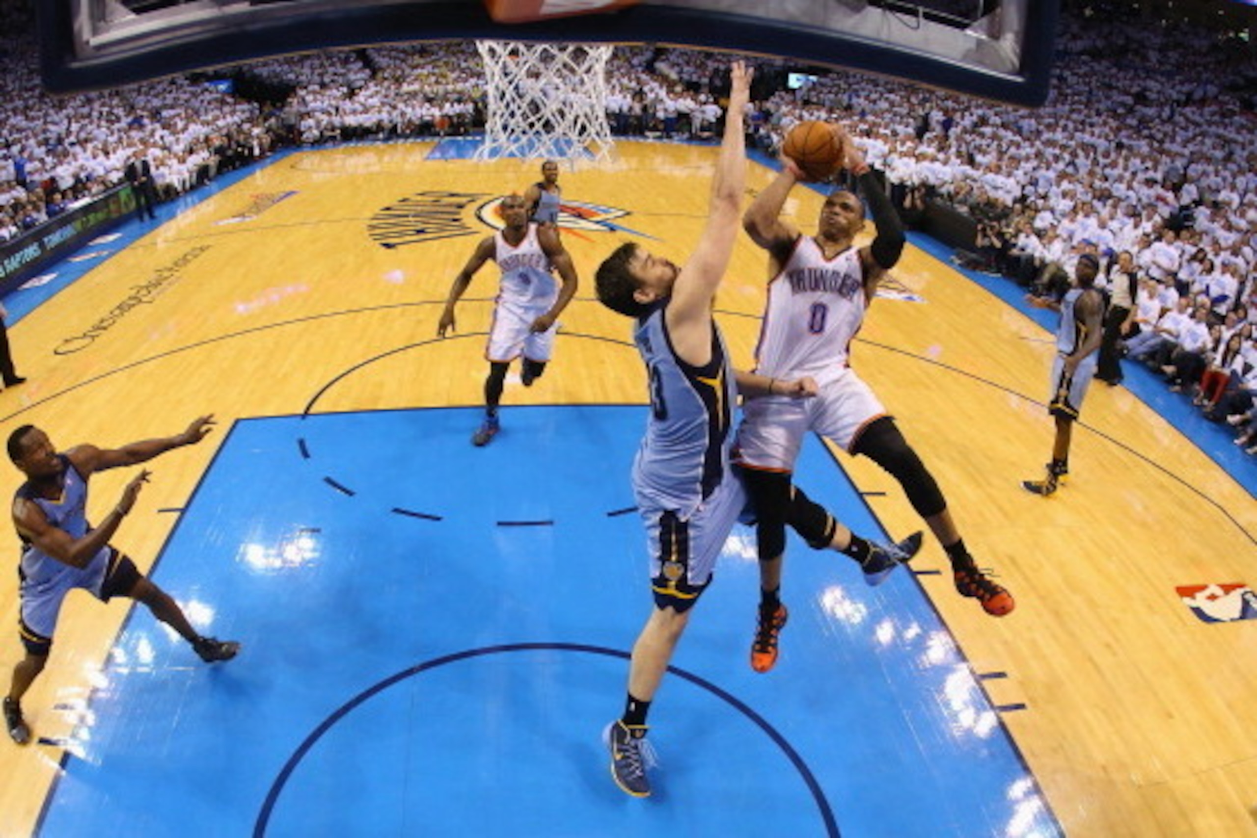 OKLAHOMA CITY, OK - APRIL 29:  Russell Westbrook #0 of the Oklahoma City Thunder takes a shot against Marc Gasol #33 of the Memphis Grizzlies in Game Five of the Western Conference Quarterfinals during the 2014 NBA Playoffs at Chesapeake Energy Arena on A