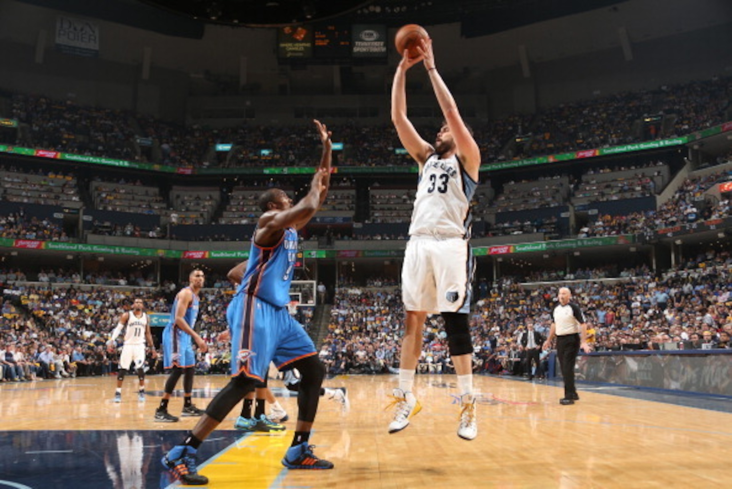 MEMPHIS, TN - APRIL 24: Marc Gasol #33 of the Memphis Grizzlies shoots against the Oklahoma City Thunder in Game Three of the Western Conference Quarterfinals during the 2014 NBA Playoffs on April 24, 2014 at FedExForum in Memphis, Tennessee. NOTE TO USER