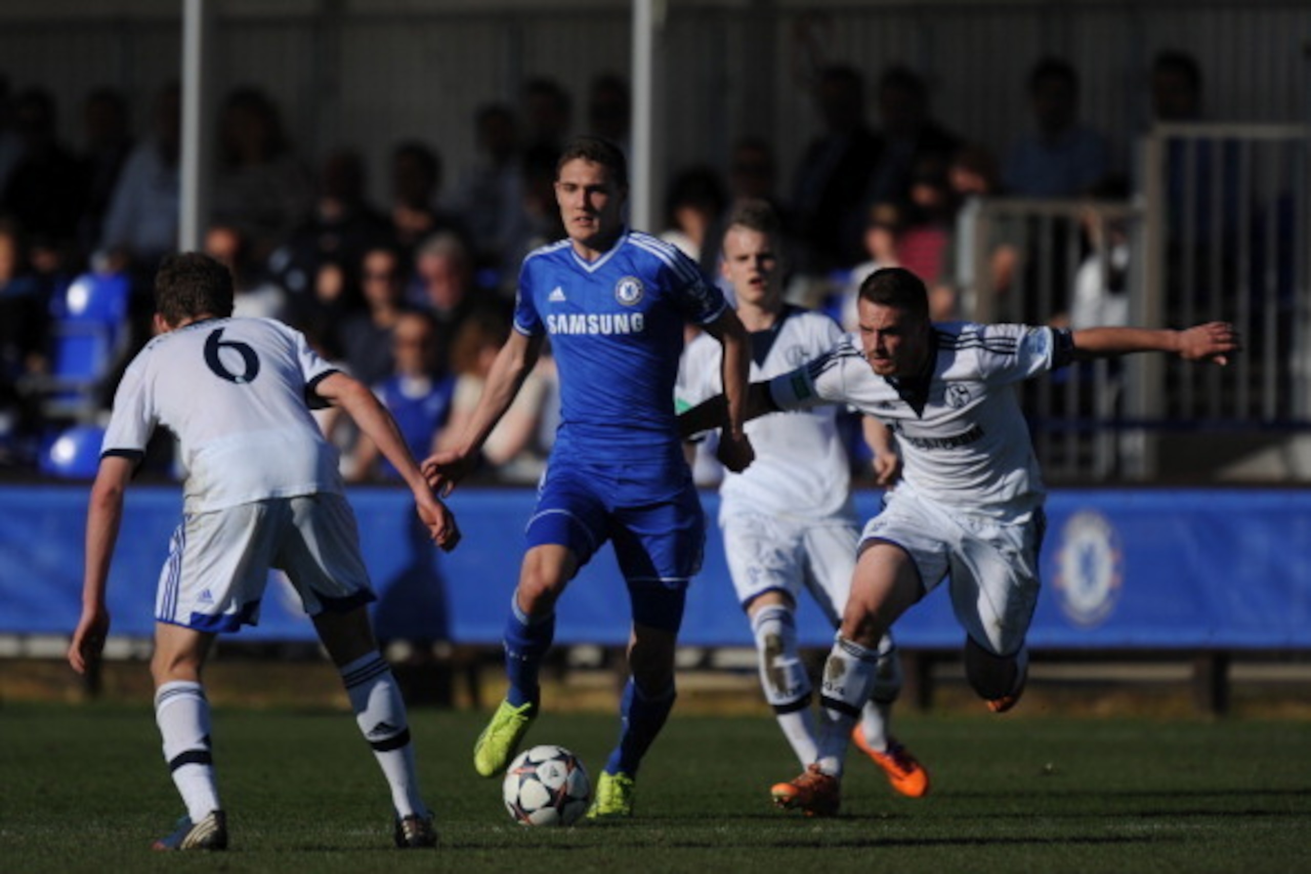 GUILDFORD, ENGLAND - MARCH 16: Andreas Christensen of Chelsea takes on the FC Schalke 04 defence during the UEFA Youth League Quarter Final match between Chelsea and FC Schalke 04 at the Chelsea Cobham training ground on March 16, 2014 in Guildford, Engla