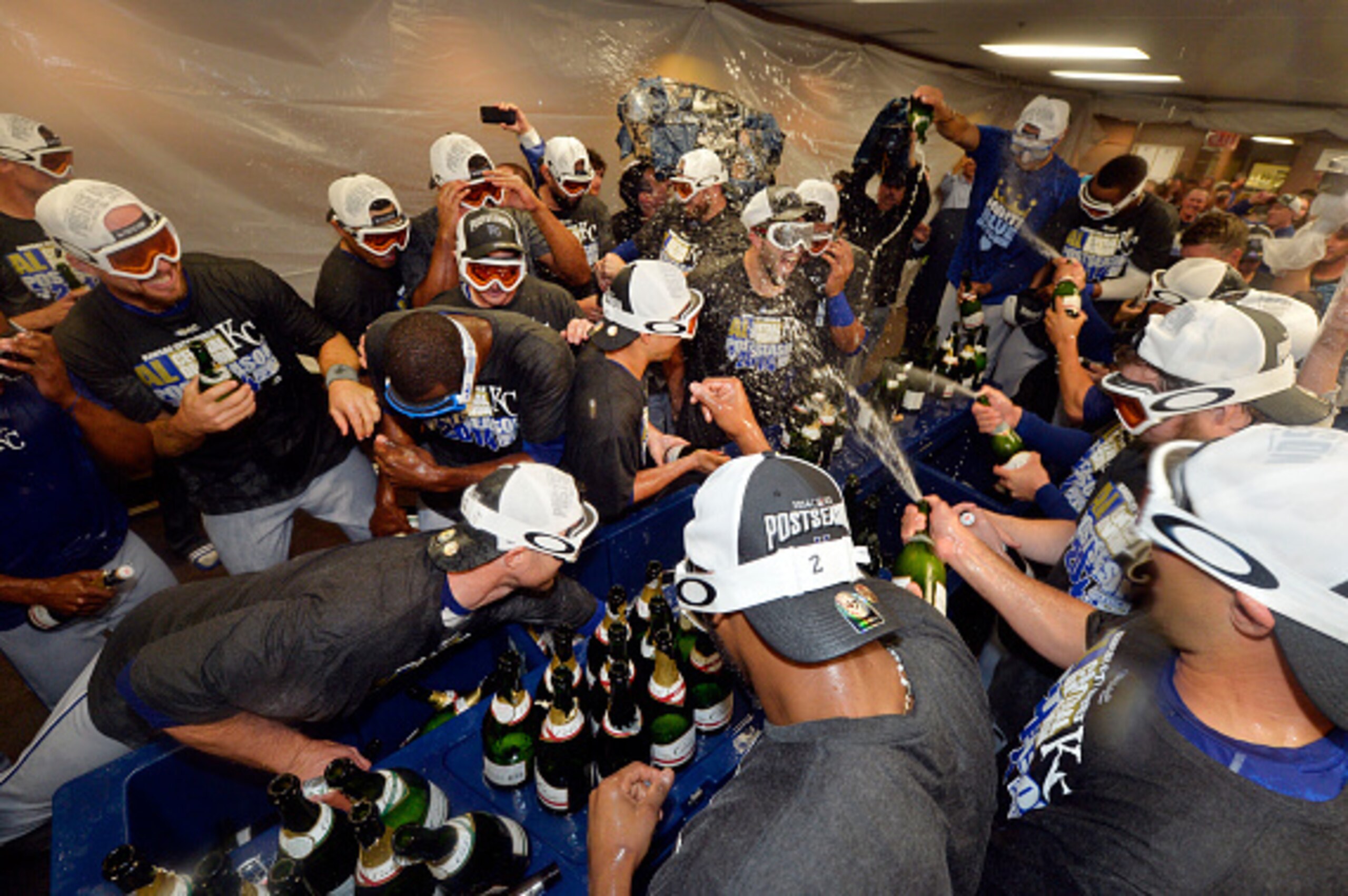 CHICAGO, IL - SEPTEMBER 26:  The Kansas City Royals celebrate in the locker room after defeating the Chicago White Sox to clinch a Wild Card berth at U.S. Cellular Field on September 26, 2014 in Chicago, Illinois. The Royals defeated the White Sox 3-1.  (