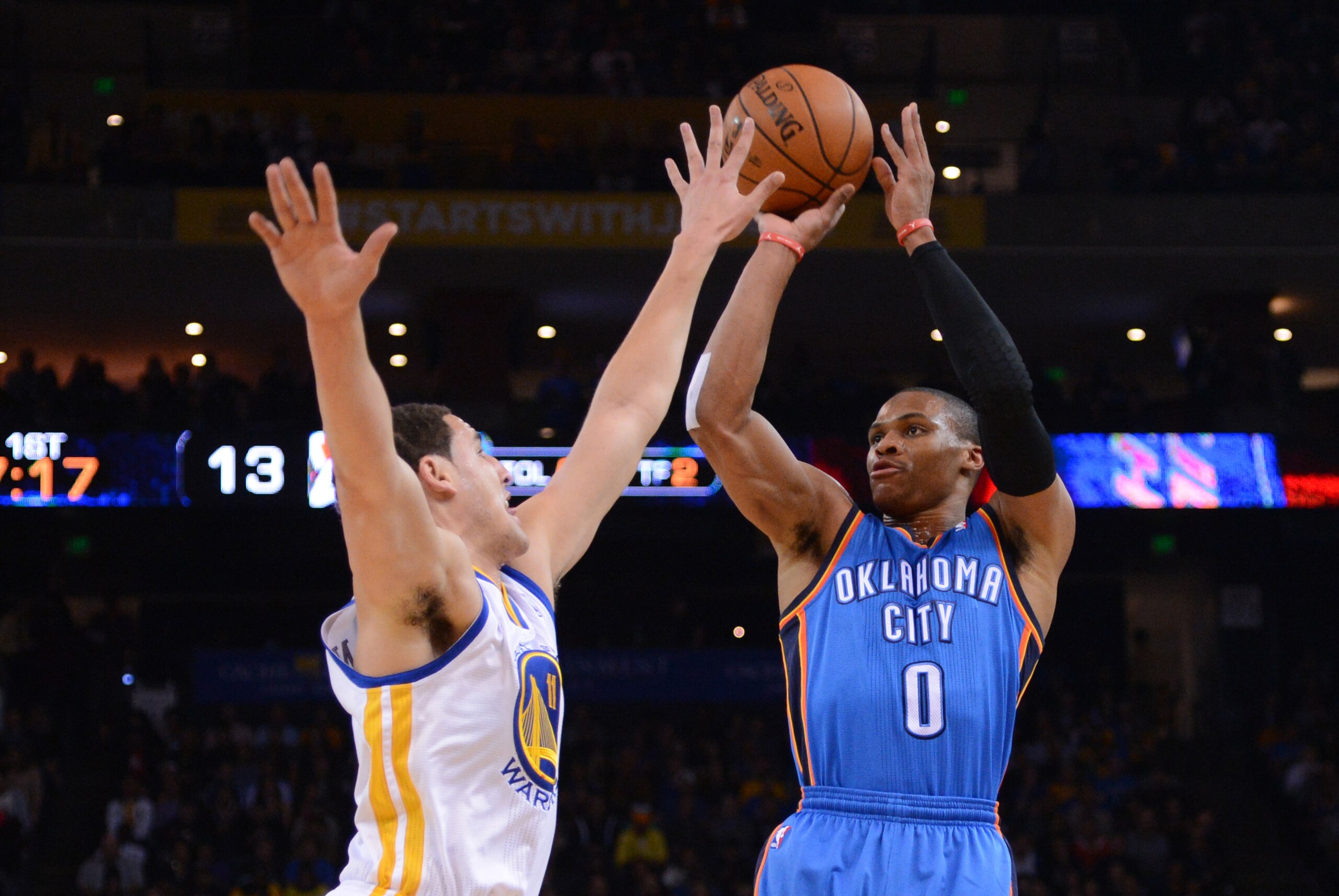 November 14, 2013; Oakland, CA, USA; Oklahoma City Thunder point guard Russell Westbrook (0) shoots the ball against Golden State Warriors shooting guard Klay Thompson (11) during the first quarter at Oracle Arena. Mandatory Credit: Kyle Terada-USA TODAY