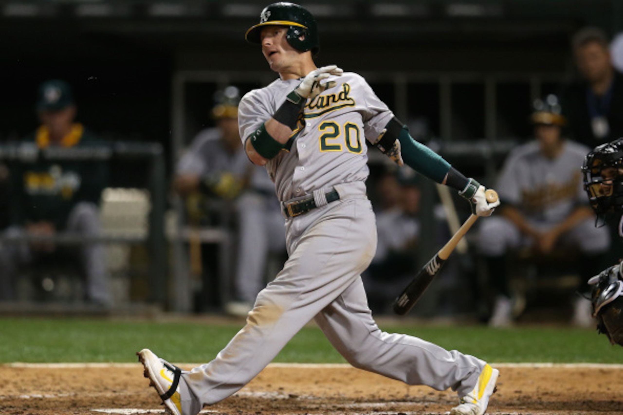 CHICAGO, IL - SEPTEMBER 10: Josh Donaldson #20 of the Oakland Athletics hits a double in the 6th inning against the Chicago White Sox at U.S. Cellular Field on September 10, 2014 in Chicago, Illinois. (Photo by Jonathan Daniel/Getty Images)