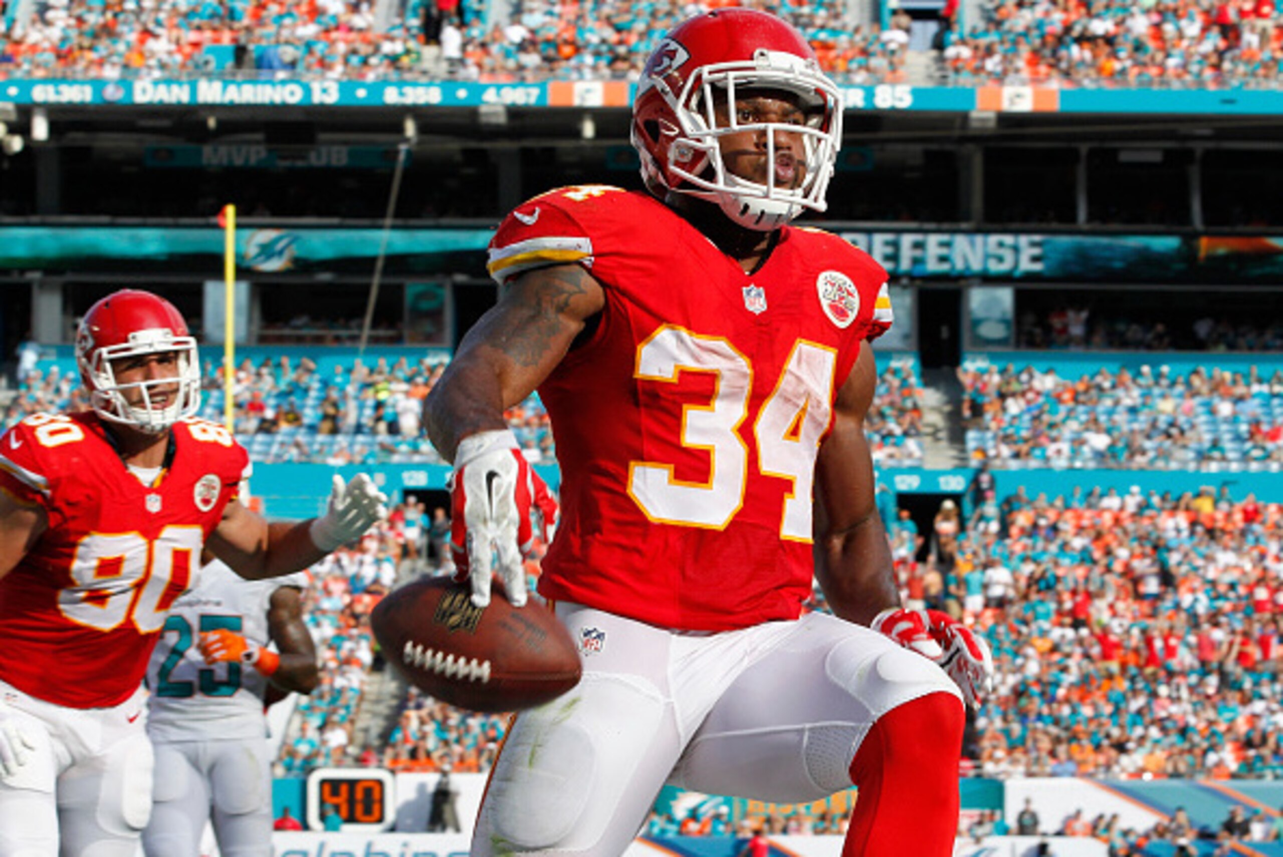MIAMI GARDENS, FL - SEPTEMBER 21: Running back Knile Davis #34 of the Kansas City Chiefs celebrates his second-quarter touchdown against the Miami Dolphins at Sun Life Stadium on September 21, 2014 in Miami Gardens, Florida. (Photo by Joel Auerbach/Gett MIAMI GARDENS, FL - SEPTEMBER 21: Running back Knile Davis #34 of the Kansas City Chiefs celebrates his second-quarter touchdown against the Miami Dolphins at Sun Life Stadium on September 21, 2014 in Miami Gardens, Florida. (Photo by Joel Auerbach/Gett