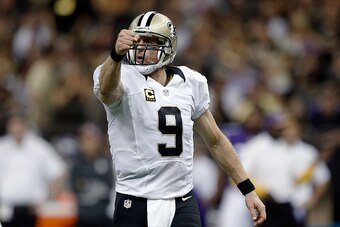 NEW ORLEANS, LA - SEPTEMBER 21:  Drew Brees #9 of the New Orleans Saints reacts to a first down during the fourth quarter of a game against the Minnesota Vikings at the Mercedes-Benz Superdome on September 21, 2014 in New Orleans, Louisiana.  (Photo by Se