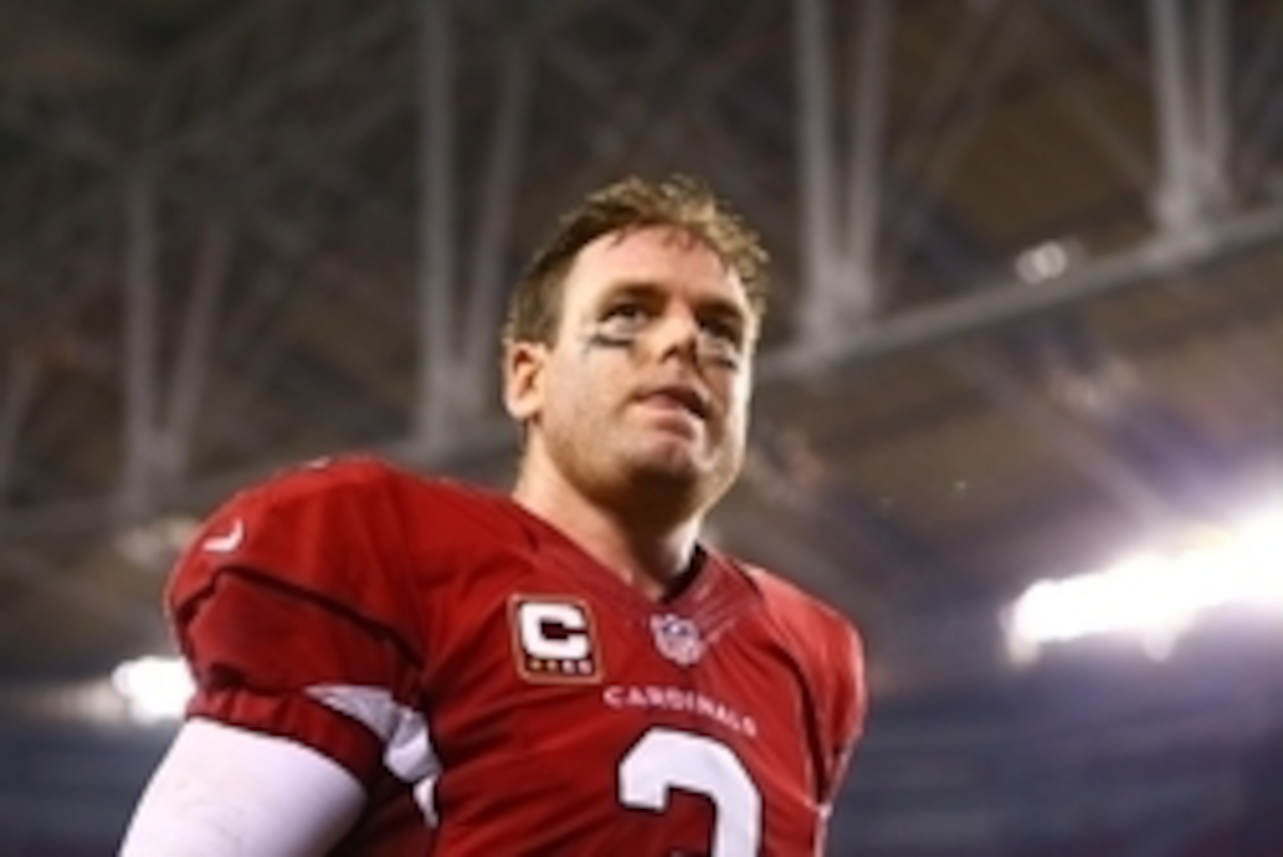Sep 8, 2014; Glendale, AZ, USA; Arizona Cardinals quarterback Carson Palmer leaves the field following the game against the San Diego Chargers at University of Phoenix Stadium. The Cardinals defeated the Chargers 18-17. Mandatory Credit: Mark J. Rebilas-U