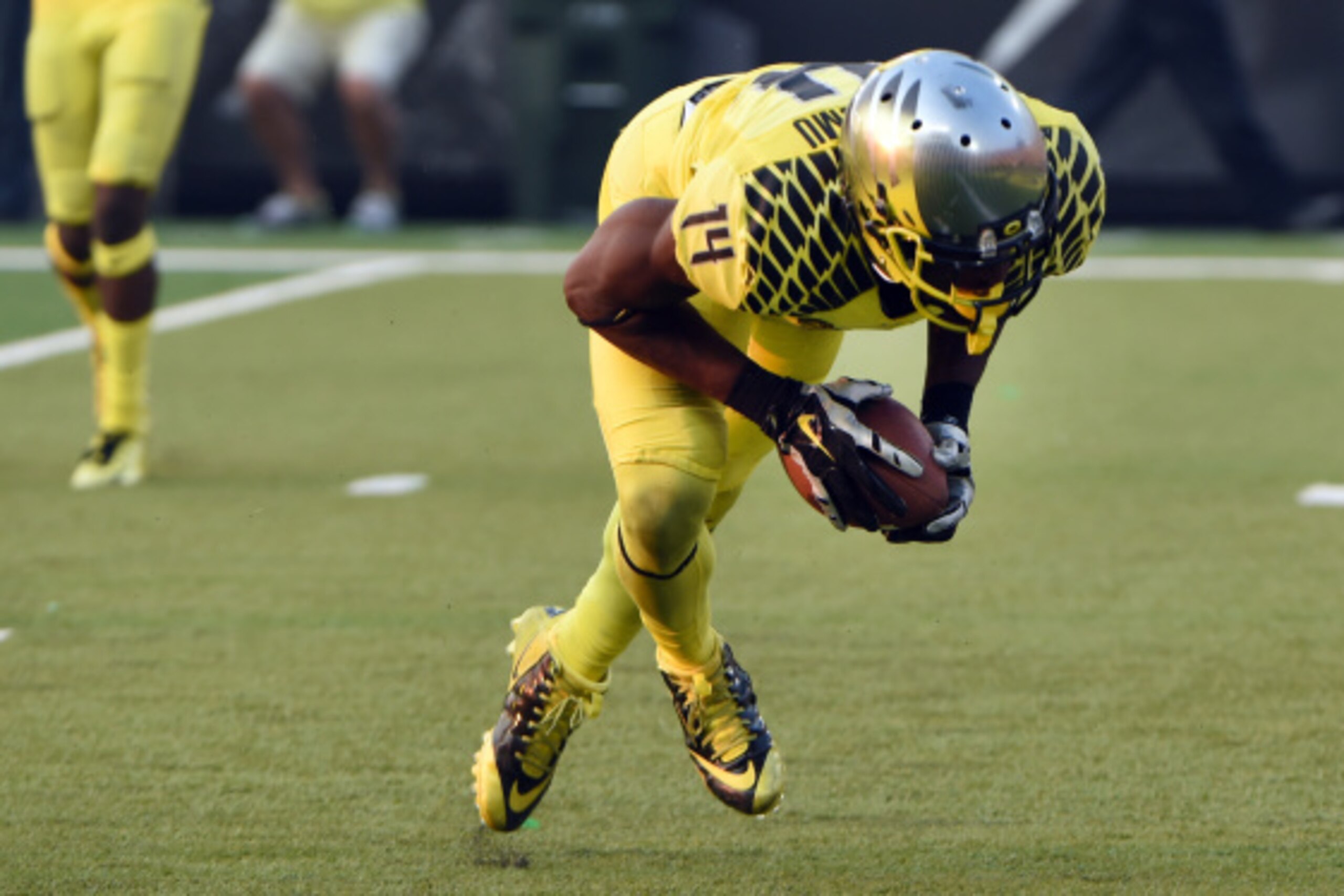 EUGENE, OR -SEPTEMBER 06: Defensive back Ifo Ekpre-Olomu #14 of the Oregon Ducks intercepts a pass during the fourth quarter of the game against the Michigan State Spartans at Autzen Stadium on September 6, 2014 in Eugene, Oregon. Oregon won the game 46-2