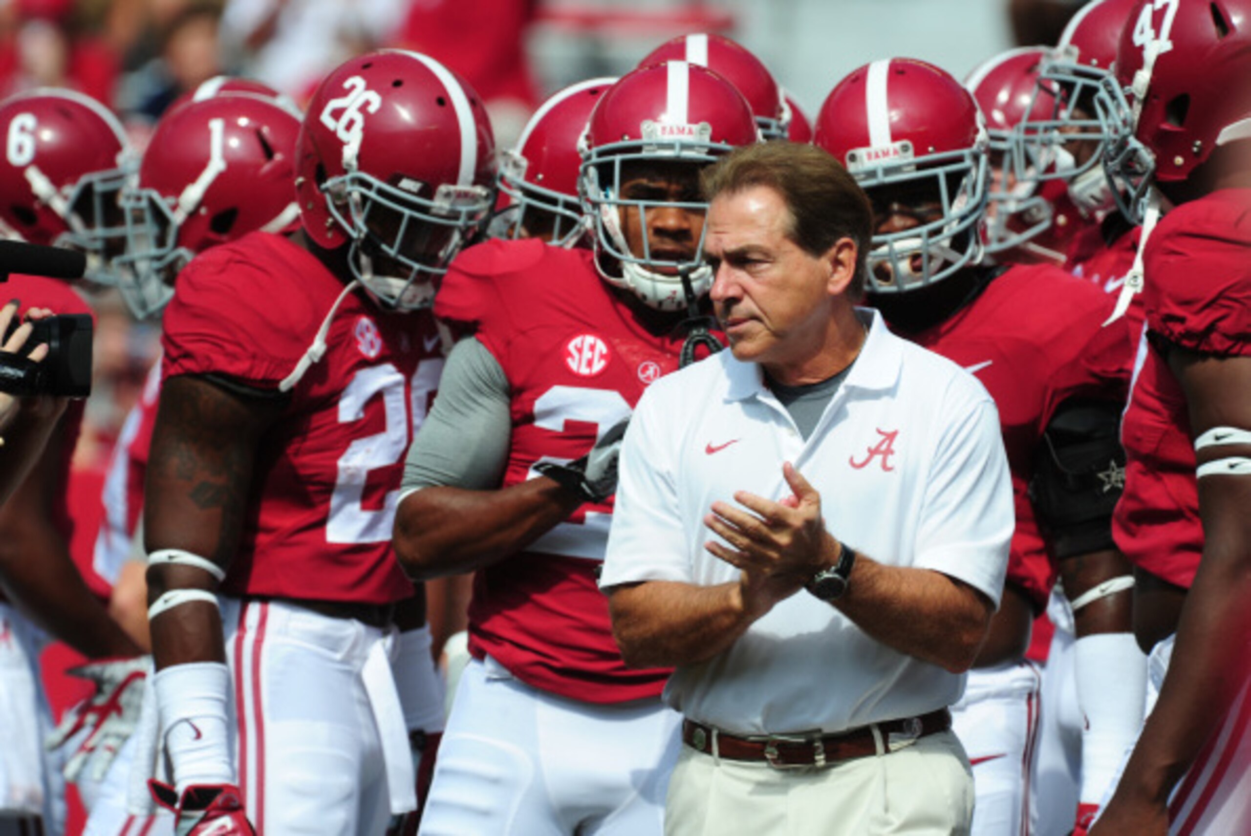 TUSCALOOSA, AL - SEPTEMBER 6: Head Coach Nick Saban of the Alabama Crimson Tide huddles with his team before the game against the Florida Atlantc Owls at Bryant-Denny Stadium on September 6, 2014 in Tuscaloosa, Alabama. (Photo by Scott Cunningham/Getty Im