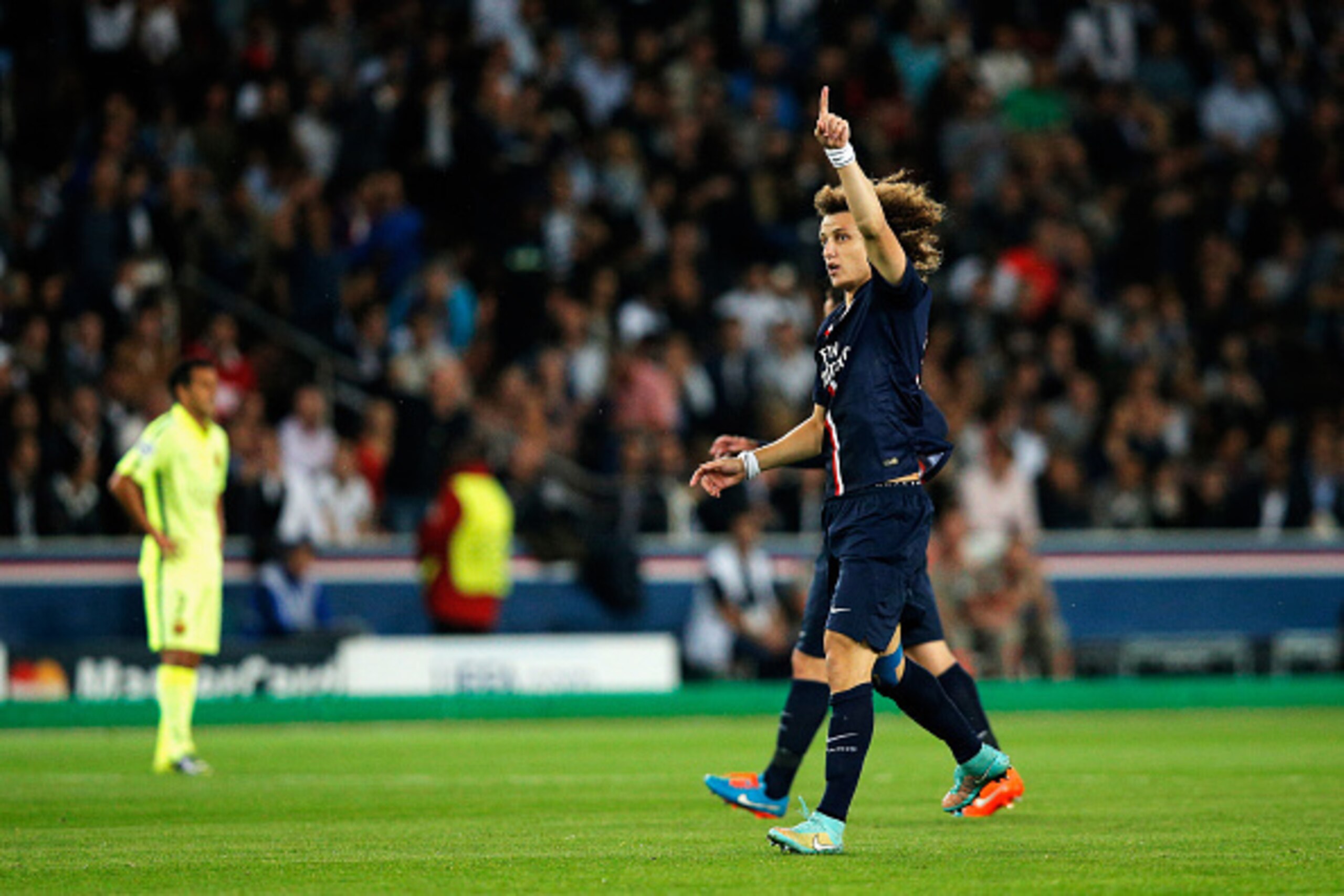 PARIS, FRANCE - SEPTEMBER 30:  David Luiz of PSG celebrates scoring a goal during the Group F UEFA Champions League match between Paris Saint-Germain v FC Barcelona held at Parc des Princes on September 30, 2014 in Paris, France.  (Photo by Dean Mouhtarop