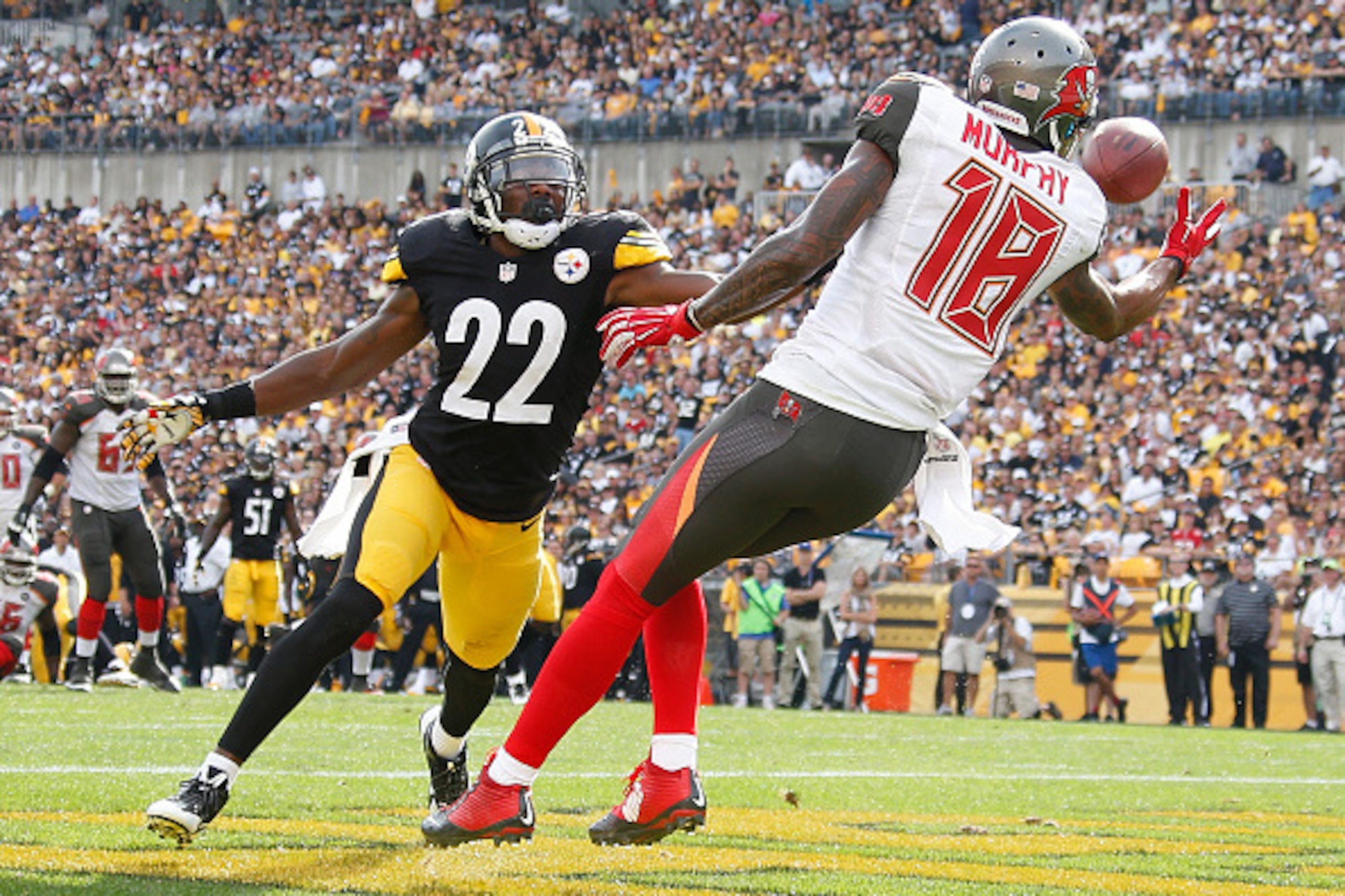 PITTSBURGH, PA - SEPTEMBER 28:  Louis Murphy #18 of the Tampa Bay Buccaneers can't make a catch in front of William Gay #22 of the Pittsburgh Steelers during the fourth quarter at Heinz Field on September 28, 2014 in Pittsburgh, Pennsylvania.  (Photo by G