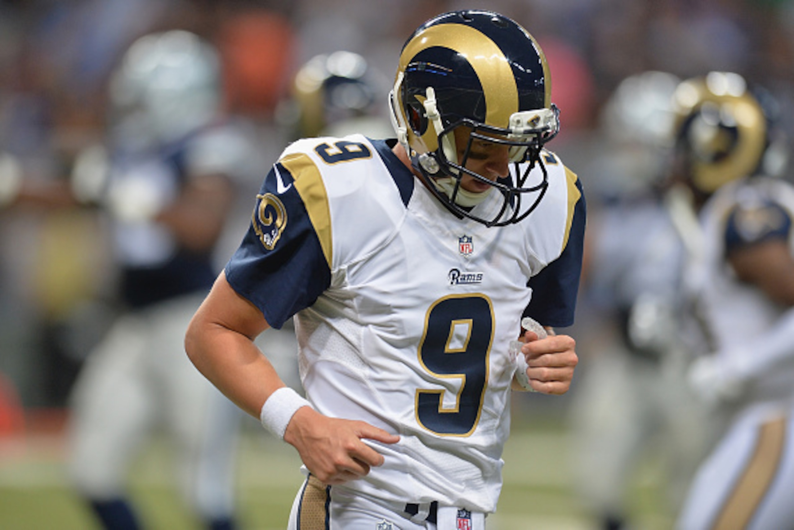 ST. LOUIS, MO - SEPTEMBER 21: Austin Davis #9 of the St. Louis Rams reacts to throwing a fourth quarter interception return for a touchdown against the Dallas Cowboys at the Edward Jones Dome on September 21, 2014 in St. Louis, Missouri.  (Photo by Michae