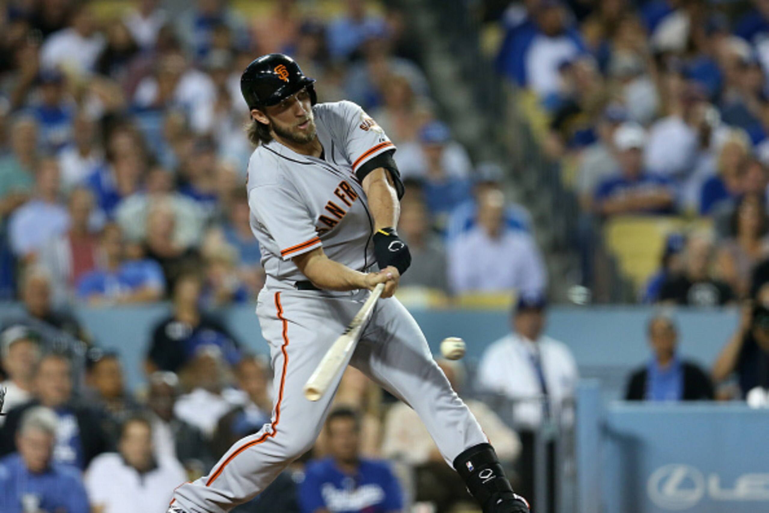 LOS ANGELES, CA - SEPTEMBER 23:  Starting pitcher Madison Bumgarner #40 of the San Francisco Giants hits a two run home run in the third inning against the Los Angeles Dodgers in the first inning at Dodger Stadium on September 23, 2014 in Los Angeles, Cal
