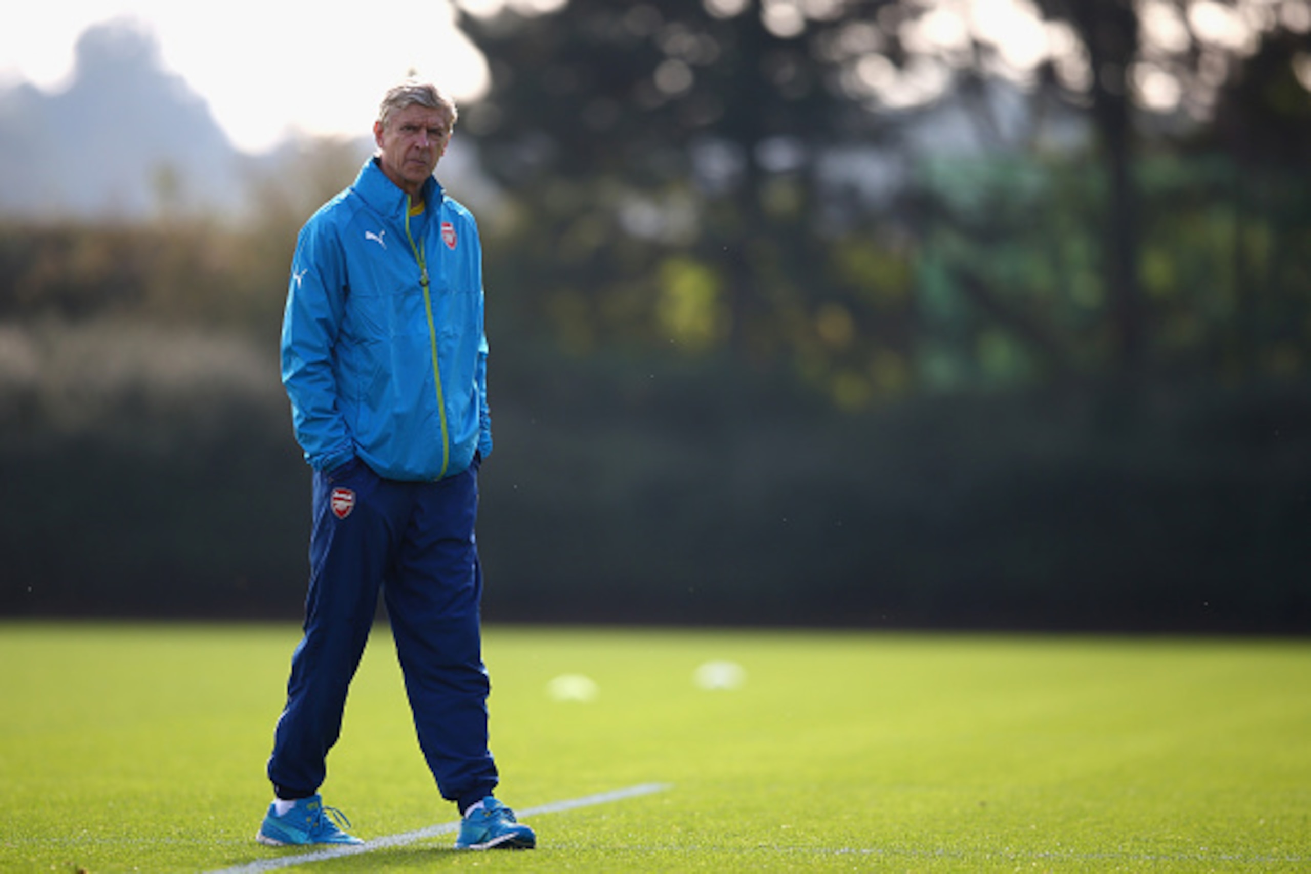 ST ALBANS, ENGLAND - SEPTEMBER 30:  Manager Arsene Wenger of Arsenal looks on during an Arsenal training session ahead of their UEFA Champions League Group D match against Galatasaray at London Colney on September 30, 2014 in St Albans, England.  (Photo b