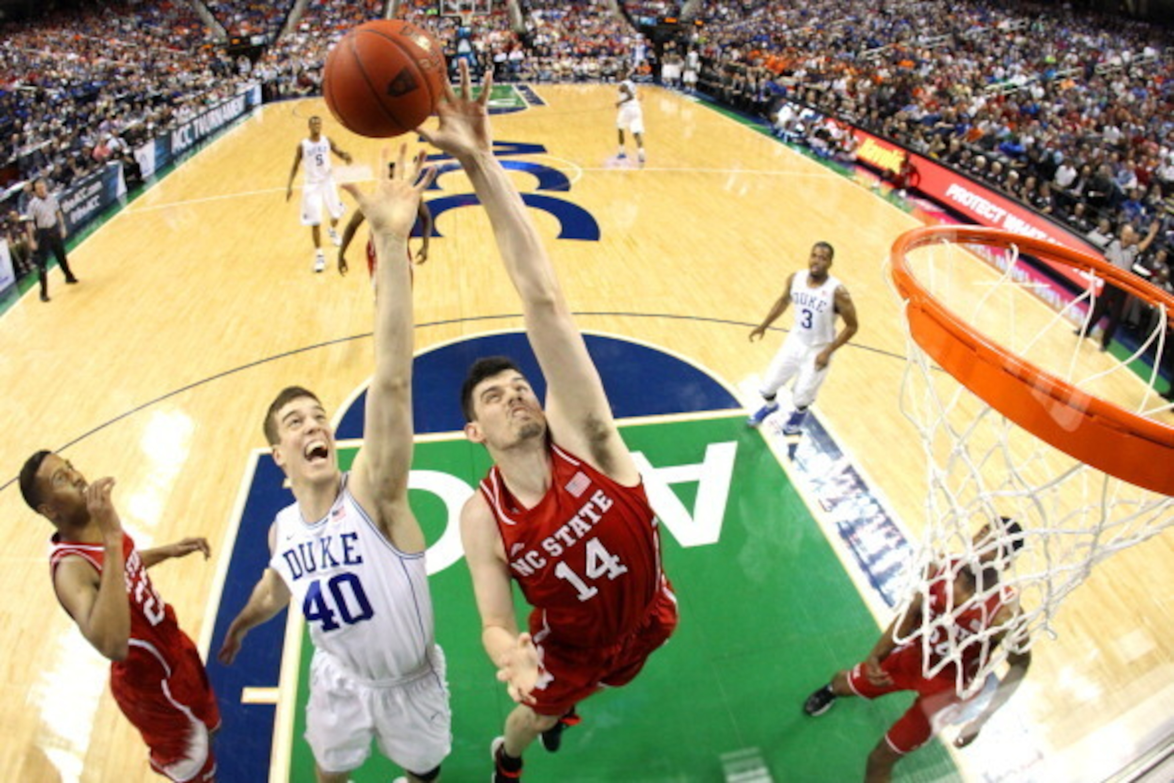 GREENSBORO, NC - MARCH 15: Jordan Vandenberg #14 of the North Carolina State Wolfpack and Marshall Plumlee #40 of the Duke Blue Devils go after a rebound during the semifinals of the 2014 Men's ACC Basketball Tournament at Greensboro Coliseum on March 15 GREENSBORO, NC - MARCH 15: Jordan Vandenberg #14 of the North Carolina State Wolfpack and Marshall Plumlee #40 of the Duke Blue Devils go after a rebound during the semifinals of the 2014 Men's ACC Basketball Tournament at Greensboro Coliseum on March 15
